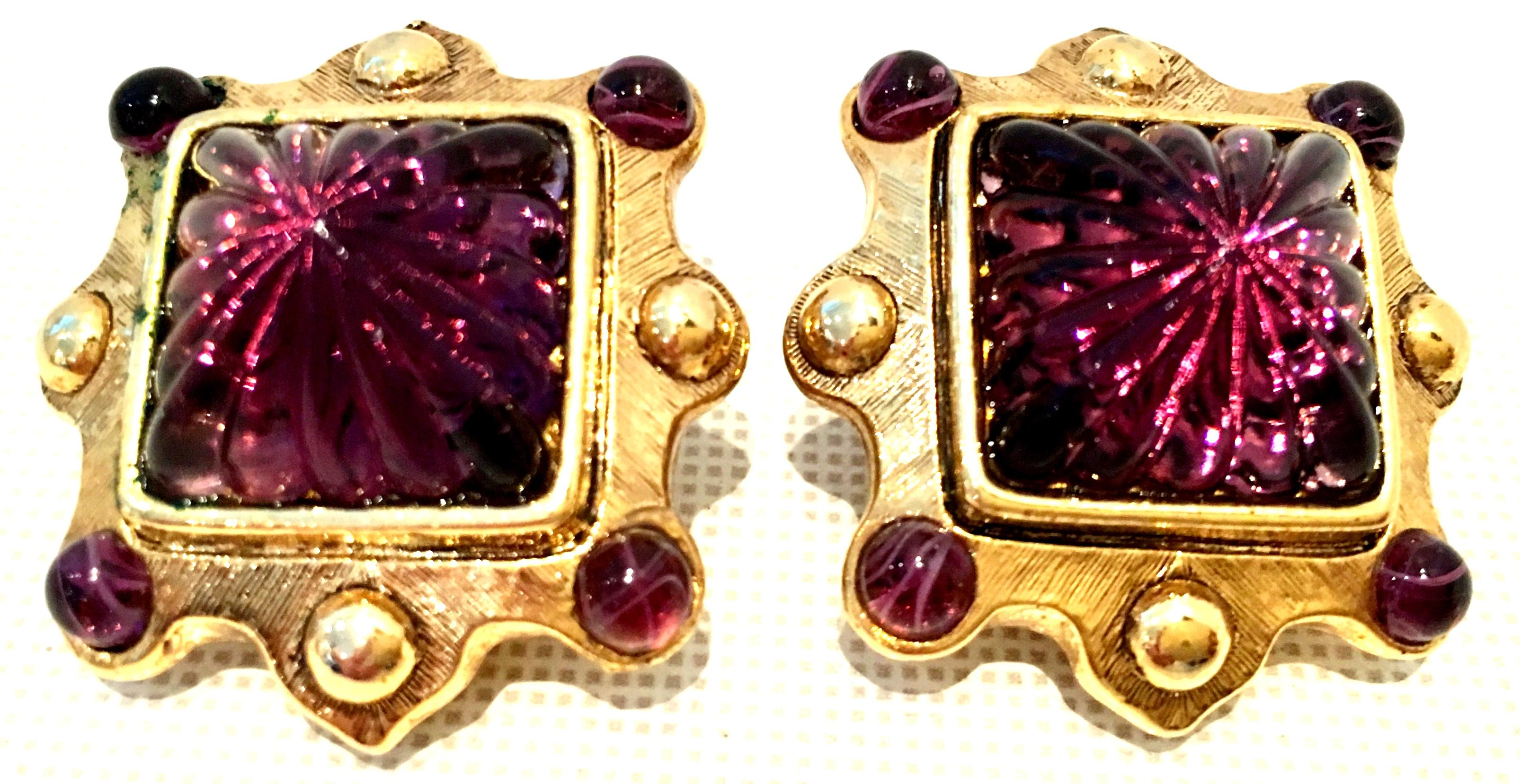 1980'S Gold Plate & Austrian Crystal Earrings By, Oscar De Le Renta. These clip style earrings feature gold plate metal with a large dimensional central cut and faceted crystal stone, small round stone surround. Signed on the underside,