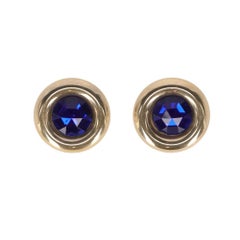 80s Gold-tone metal round clip-on earrings with blue stone