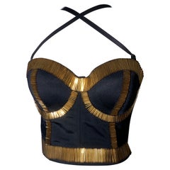 Bustier in spandex di ispirazione anni '80 con bordi lunghi in perline dorate e spalline regolabili