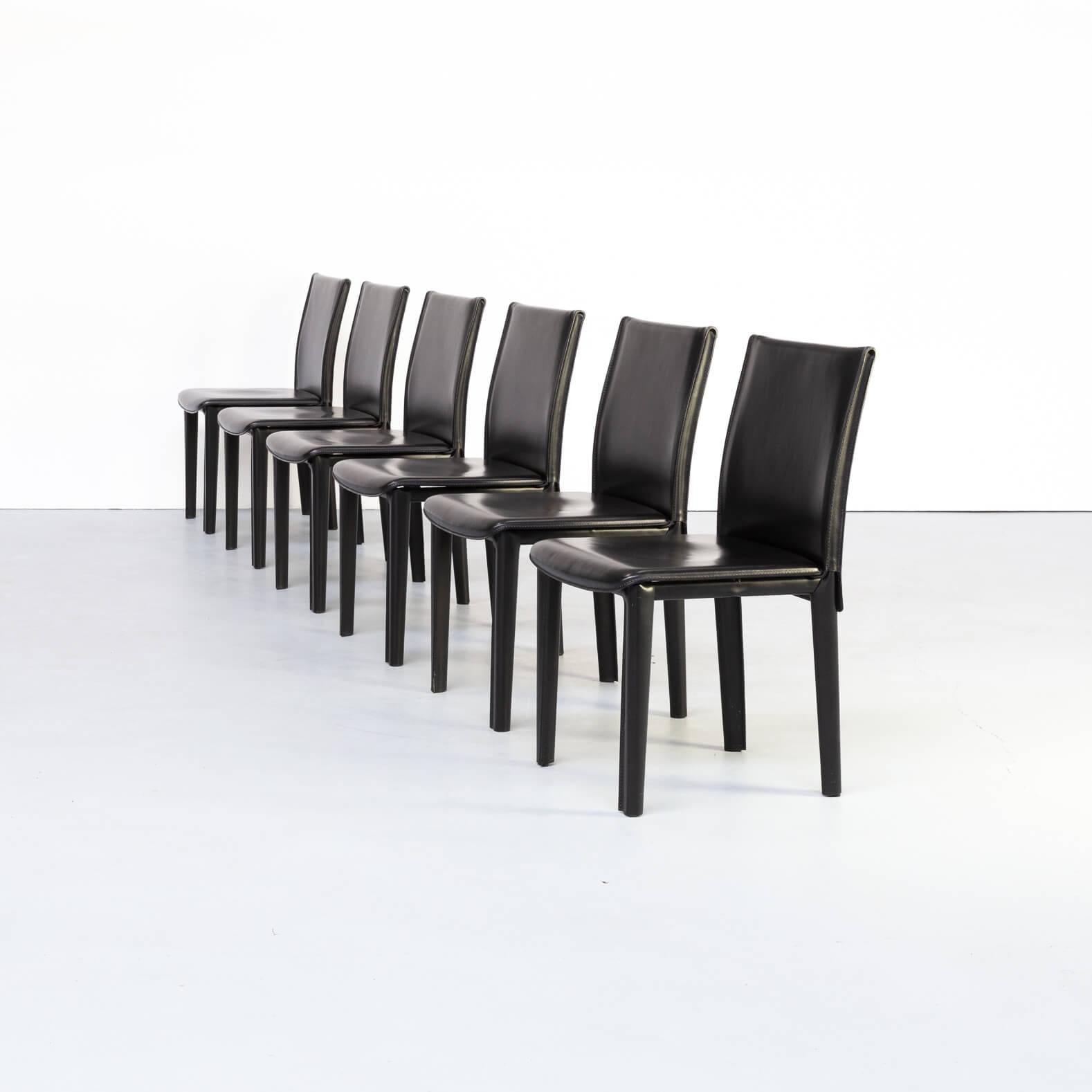 Arper mainly surprises with modernistic designs combined with a lot of comfort.These high back dining room chairs are in black leather on metal frames. Set in good condition consistent with age and use.