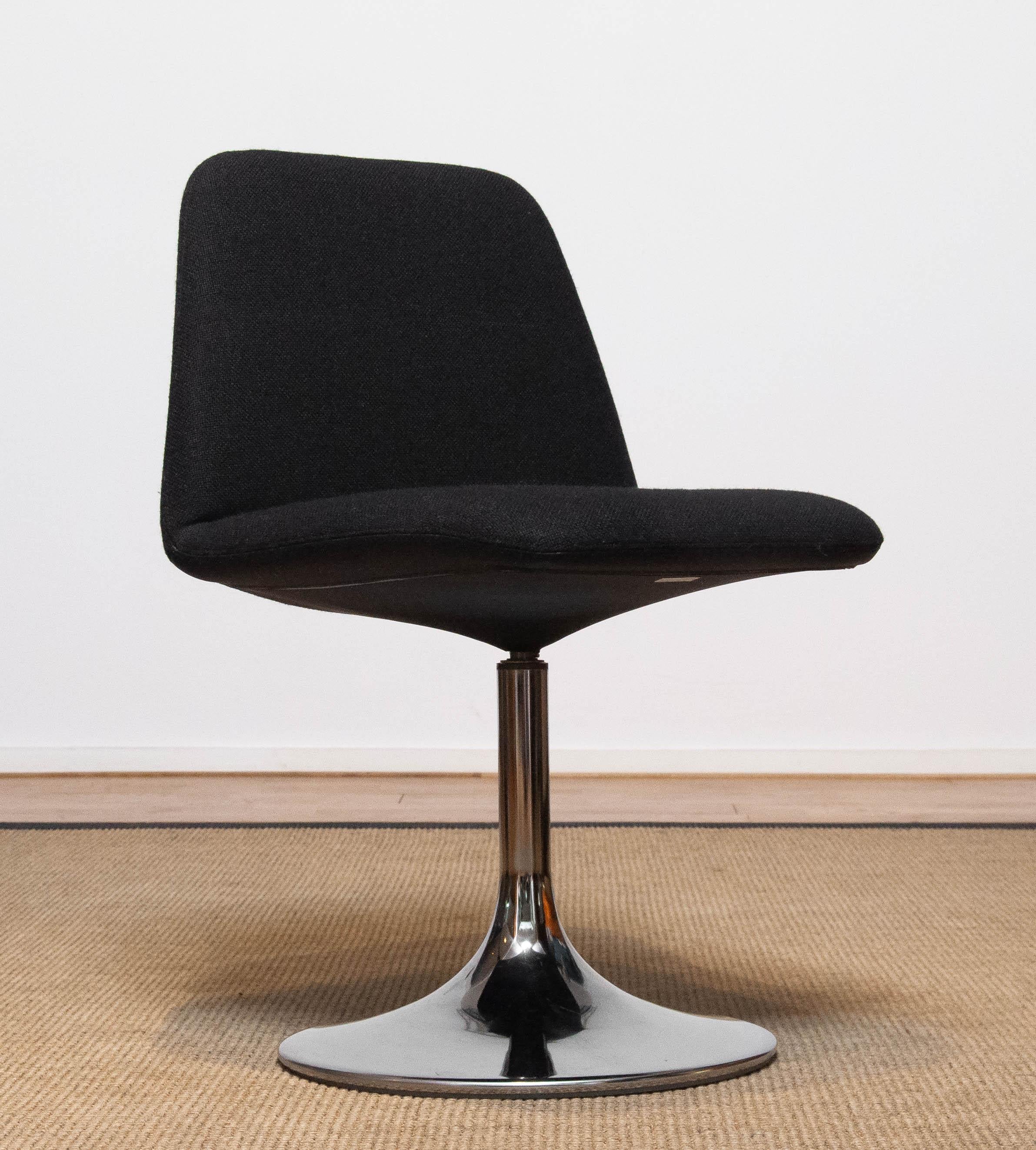 Beautiful and fully original chromed tulip shaped base swivel chair designed by Börje Johanson for Johanson Design Markaryd in Sweden. Model 