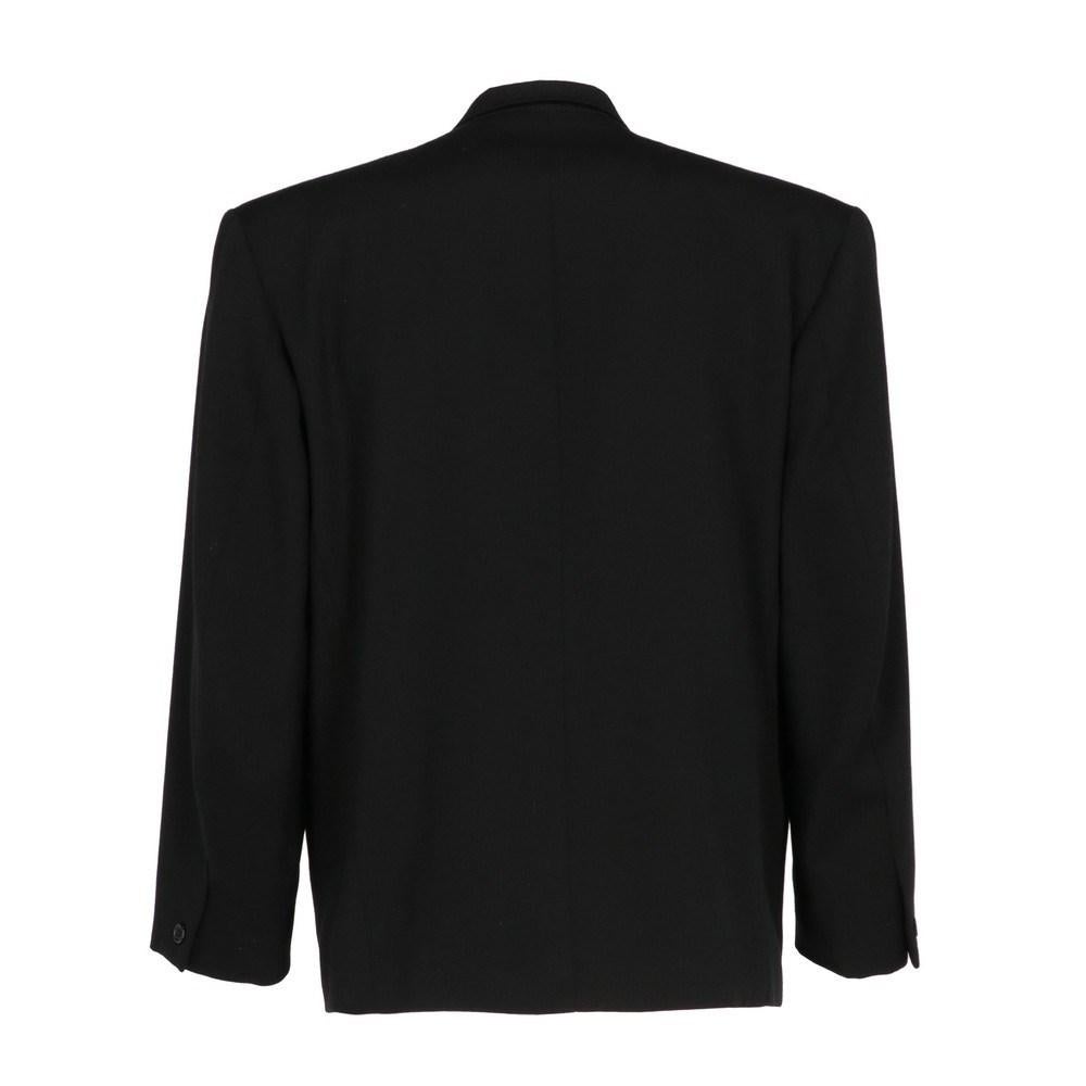 Kenzo black wool jacket. Classic lapel collar, front button closure, welt pockets and long sleeves. Fully lined.

Size: 48 IT

Flat measurements
Height: 74 cm
Bust: 54 cm
Shoulders: 50 cm
Sleeves: 59 cm

Product code: X0863

Composition: Outer: 100%