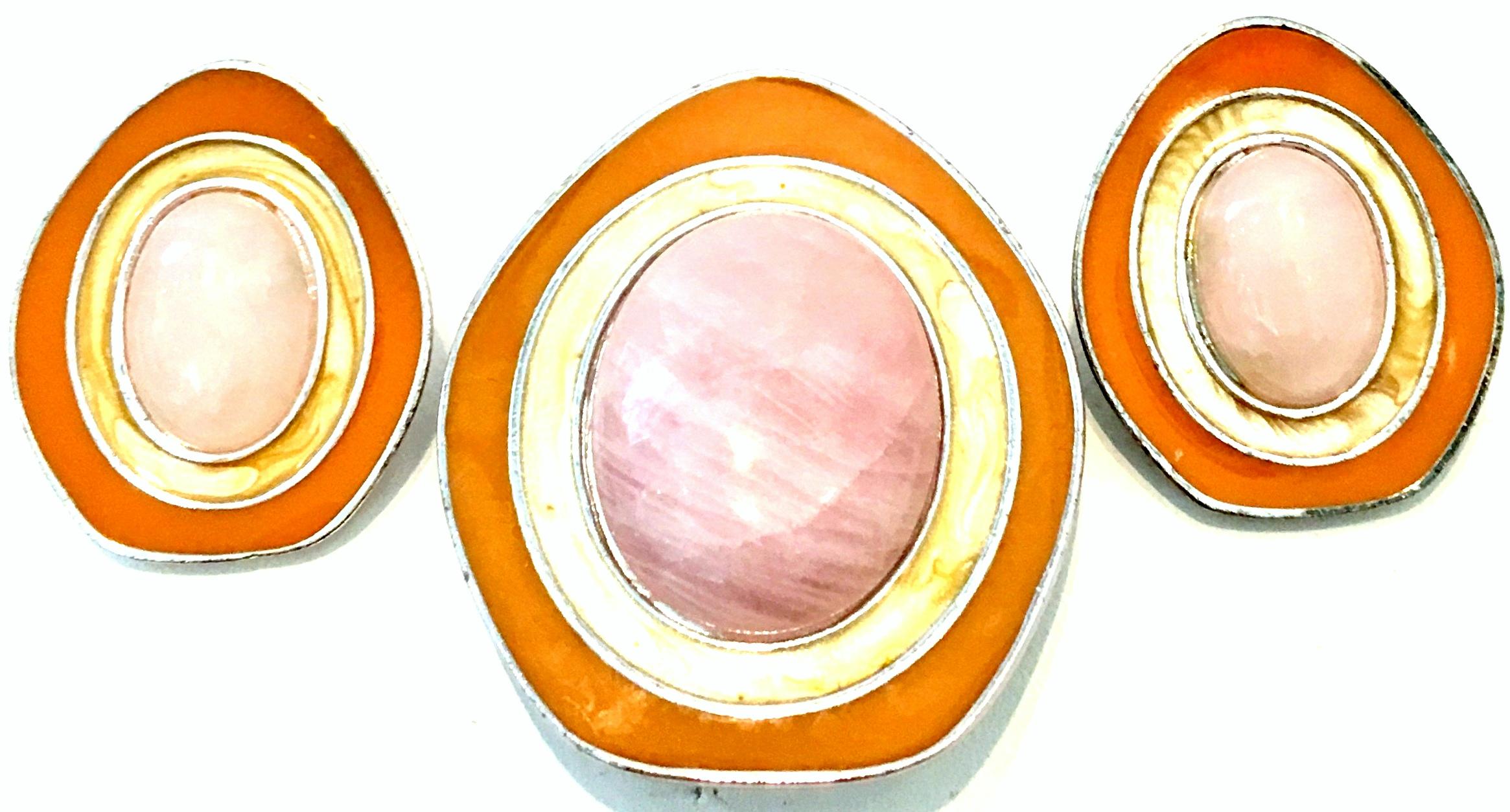 1987 Mod Silver Plate, Rose Quartz & Enamel Dimensional Pair of Earrings & Necklace Pendant/Brooch By, Celia Sebiri for Avon. This iconic and coveted geometric modern designed three piece set features silver plate metal with orange and yellow enamel