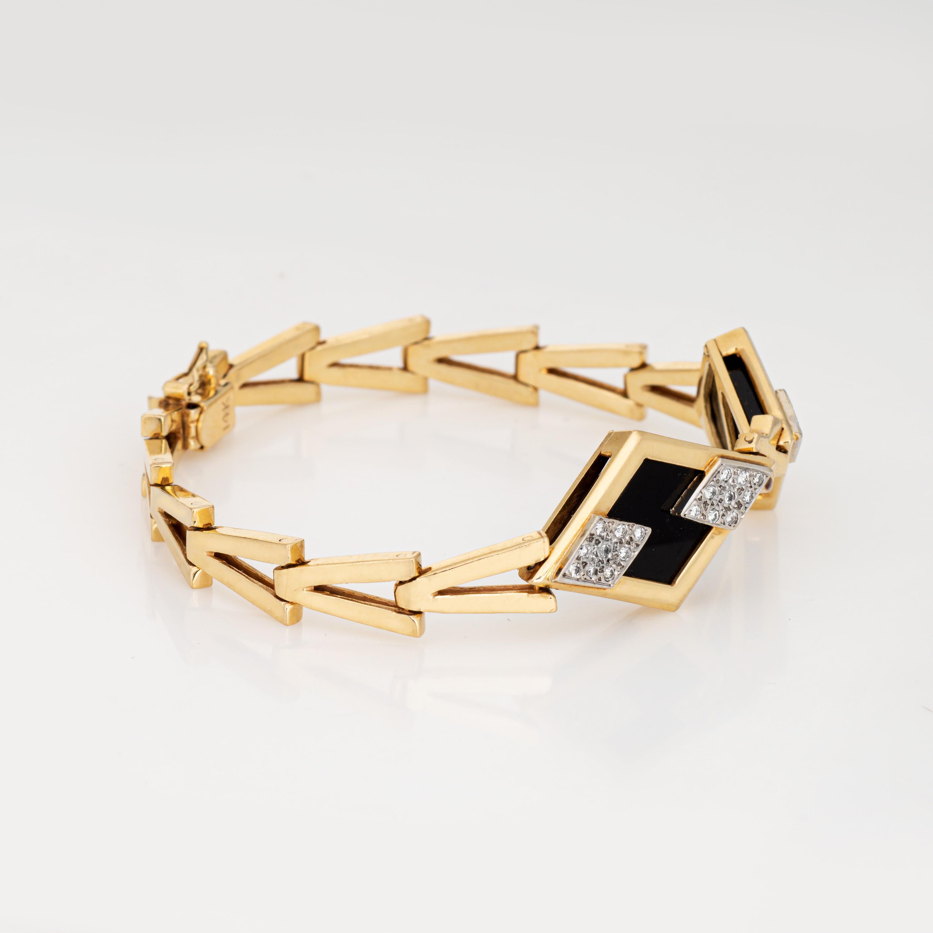 Stylish and finely detailed vintage onyx & diamond bracelet crafted in 14 karat yellow gold (circa 1980s). 

27 diamonds total an estimated .013 carats (estimated at H-I color and SI1-I2 clarity). Onyx measures 10mm x 11mm (in very good condition