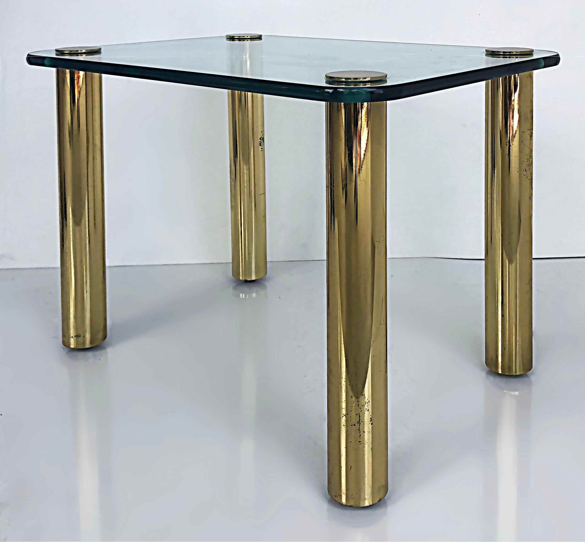 '80s Pace Collection Glass Top Side Table with Brass Legs

Offered for sale is a 1980s Pace Collection side table with a substantial glass top with rounded edges and rounded corners. The glass is supported by four brass legs that attach to the glass