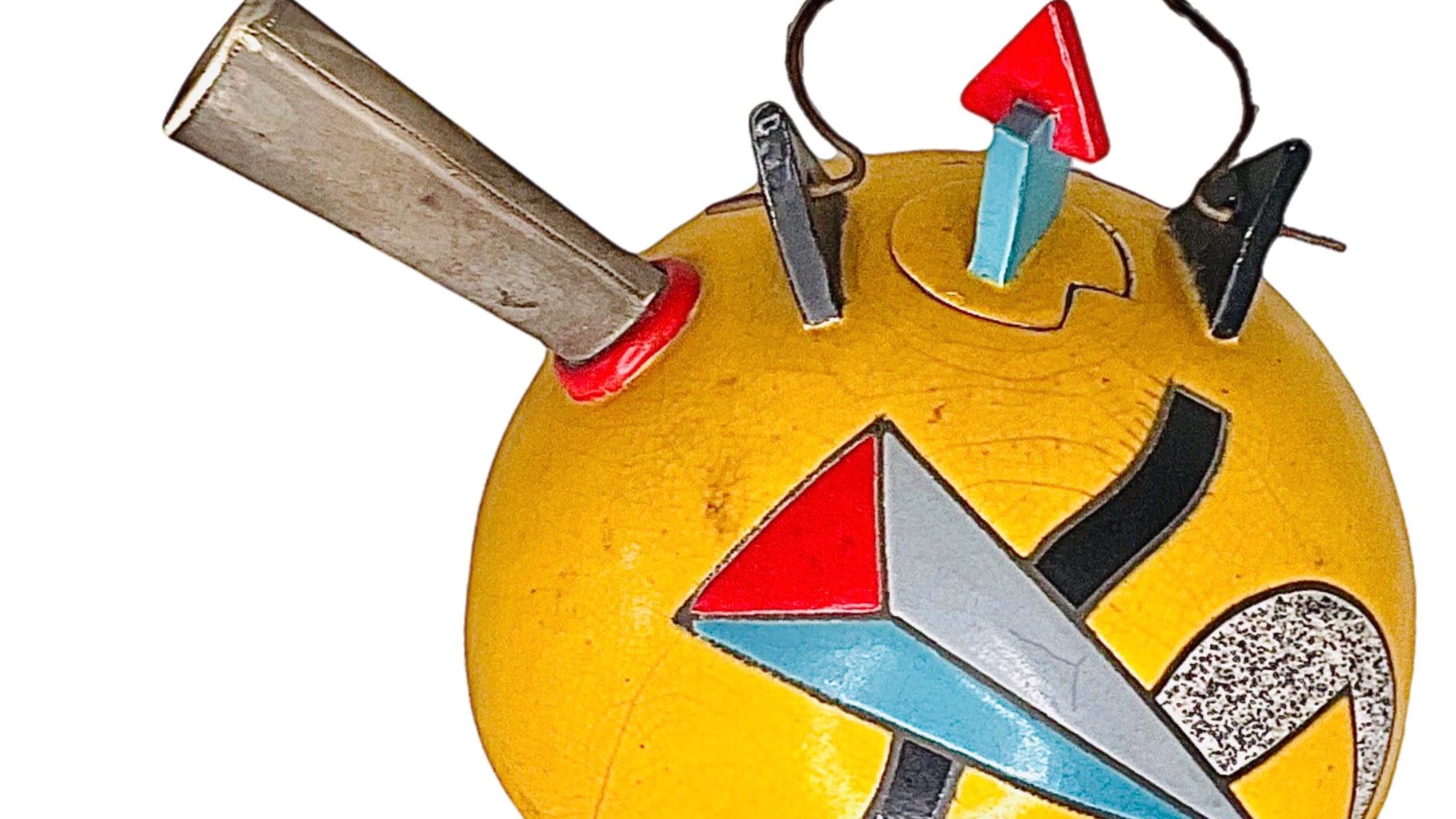 Spectacular, Post Modern, Memphis Design, One of a Kind,  Handmade, tossed and painted yellow tea pot, adorned with both incised and applied colorful geometric designs by noted Ceramic artist, Marilee Hall.

The teapot is hand signed, by the artist,