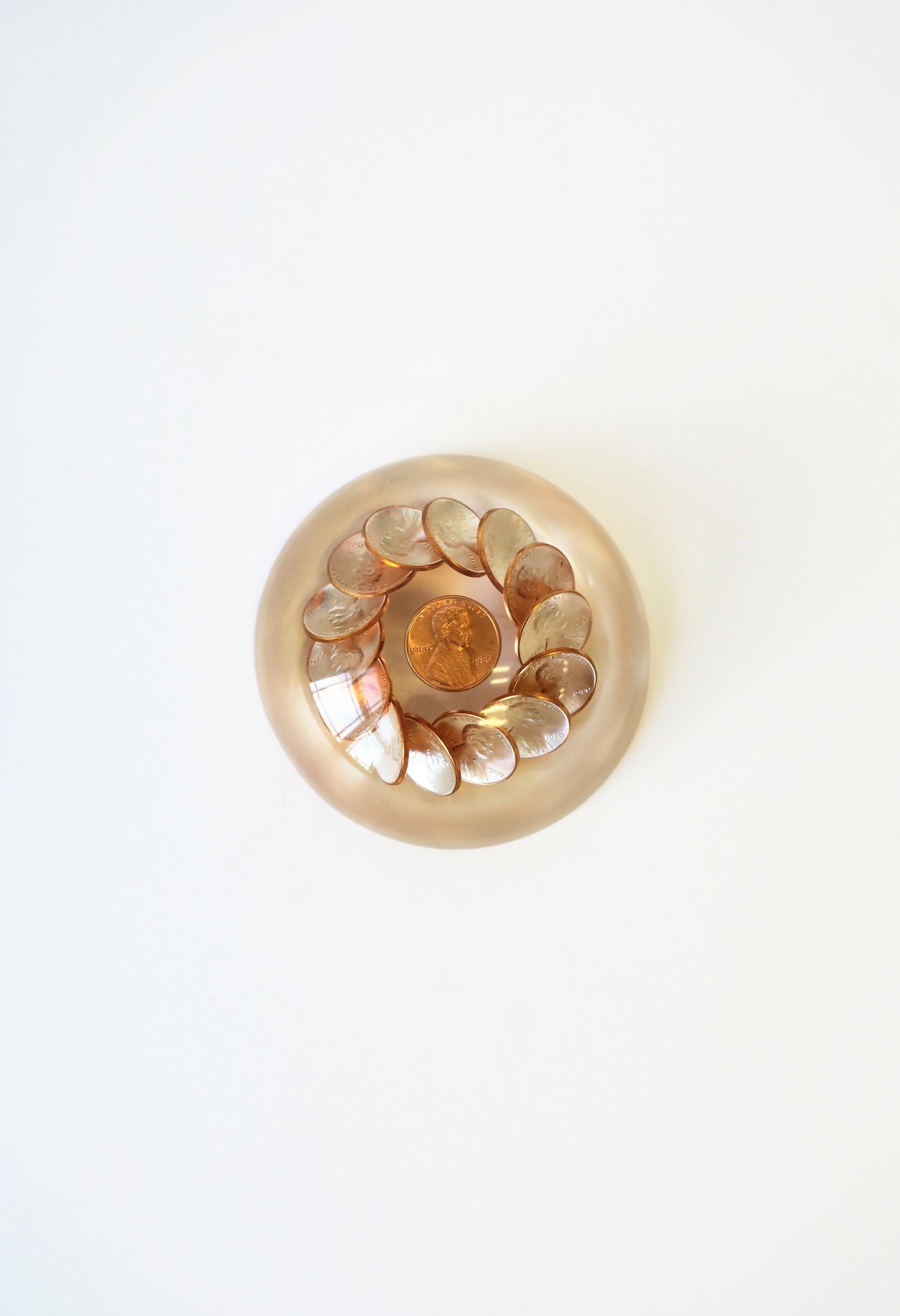 An '80s modern or Postmodern period Lucite and copper U.S. penny paperweight, 1980, USA. All pennies are of the year 1980. A great desk accessory or decorative object. Dimensions: 3.5