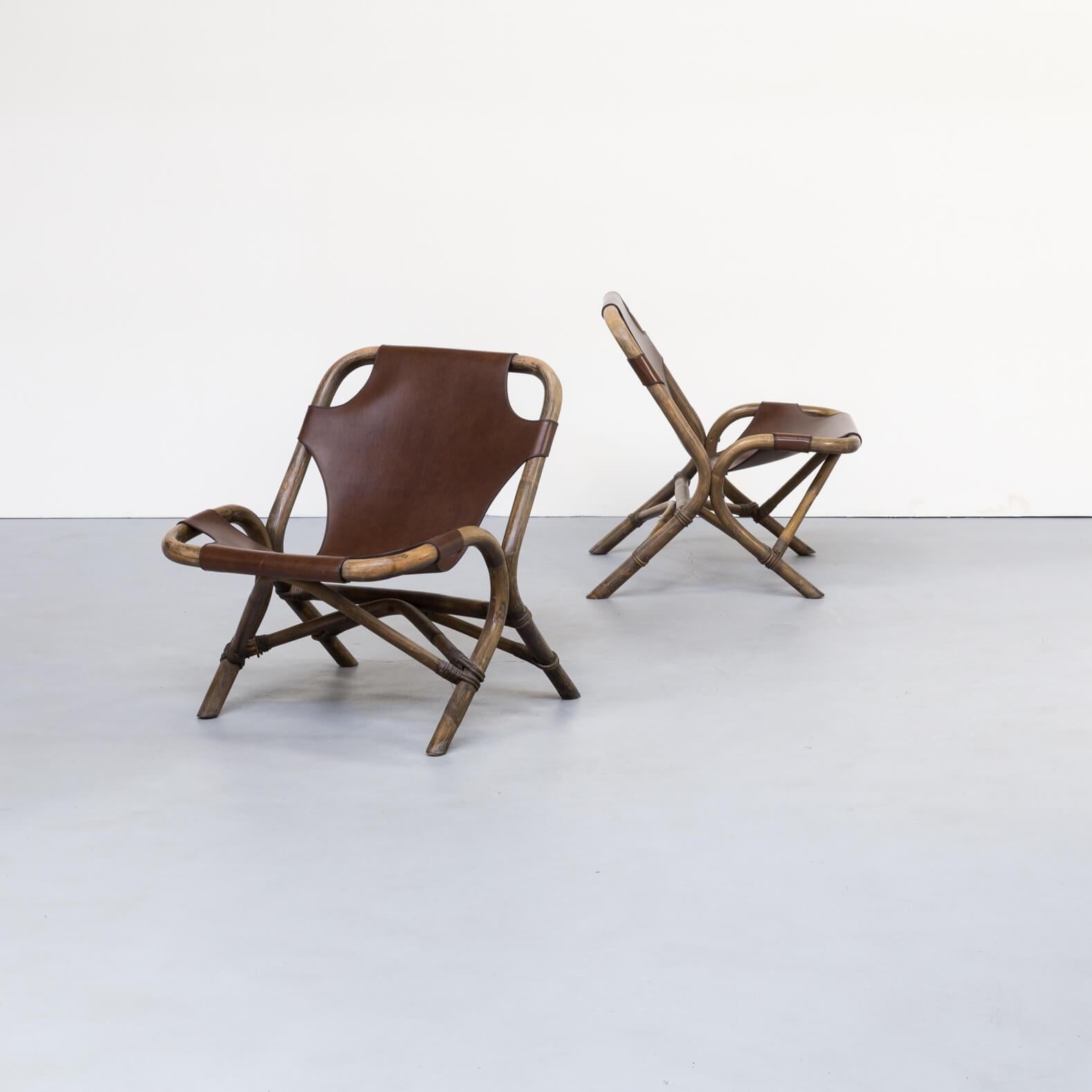 1980s Skai leather lounge chairs, bamboo frame. Nice set of two identical bamboo framed lounge chairs with strong Skai leather saddle seating. Relatively lightweight chairs with comfortable seat. Good condition consistent with age and use.