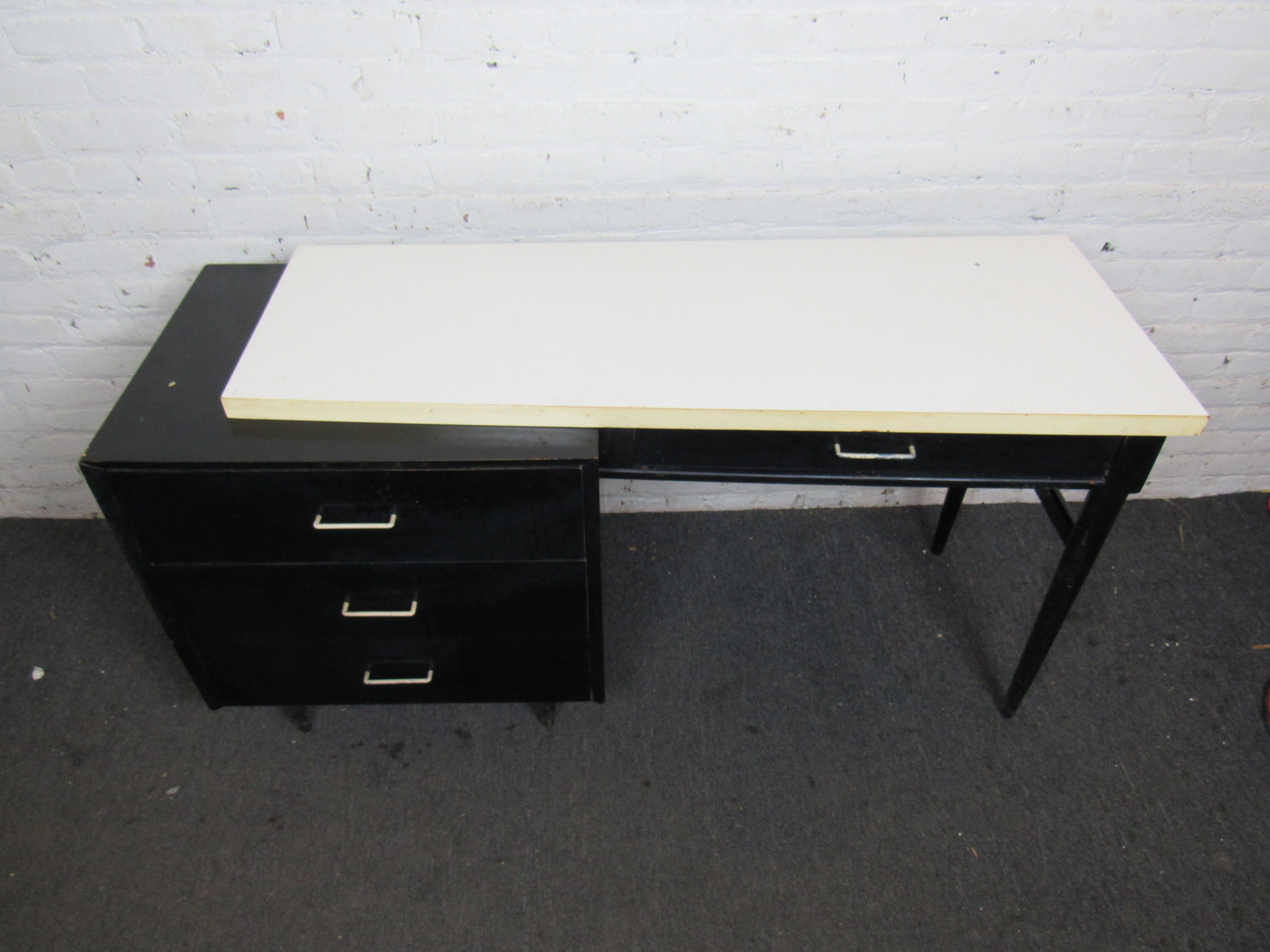 Interesting 1980s era writing desk. Black lacquer and white laminent tops by Carlton House Furniture. 

 