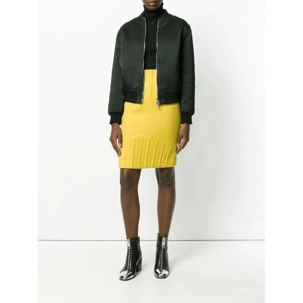 Thierry Mugler yellow wool tube 80s skirt with high waist and embossed details on the waist and on the hem. Back zip fastening and slit.

Size: 42 IT

Flat measurements
Height: 57 cm
Waist: 34 cm
Hips: 42 cm

Product code: A7348

Composition:
Outer: