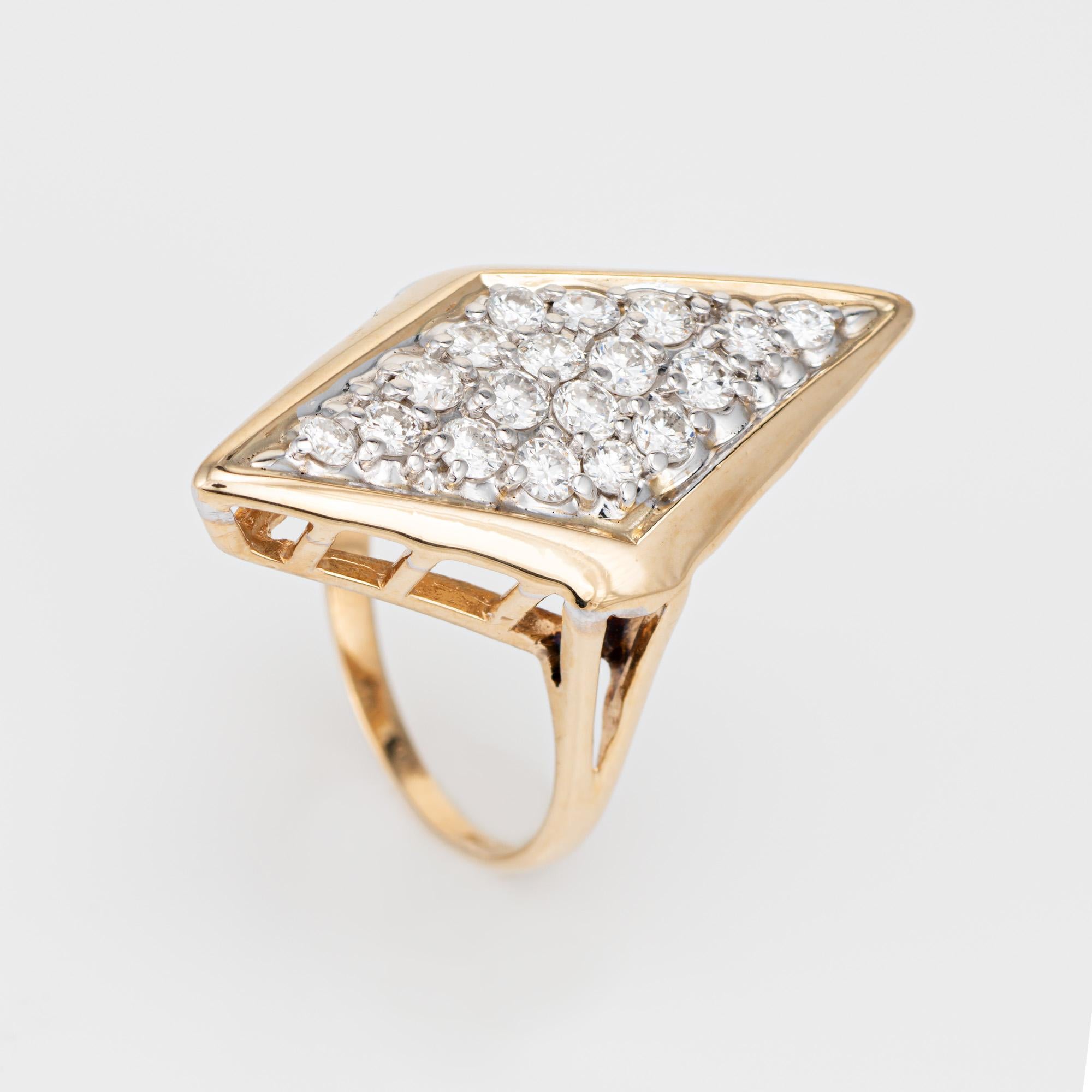 Stylish vintage diamond triangle cocktail ring crafted in 14 karat yellow gold (circa 1980s). 

18 diamonds total an estimated 0.40 carats (estimated at I-J color and SI1-I1 clarity). 

Bold and distinct, the large cocktail ring makes a bold