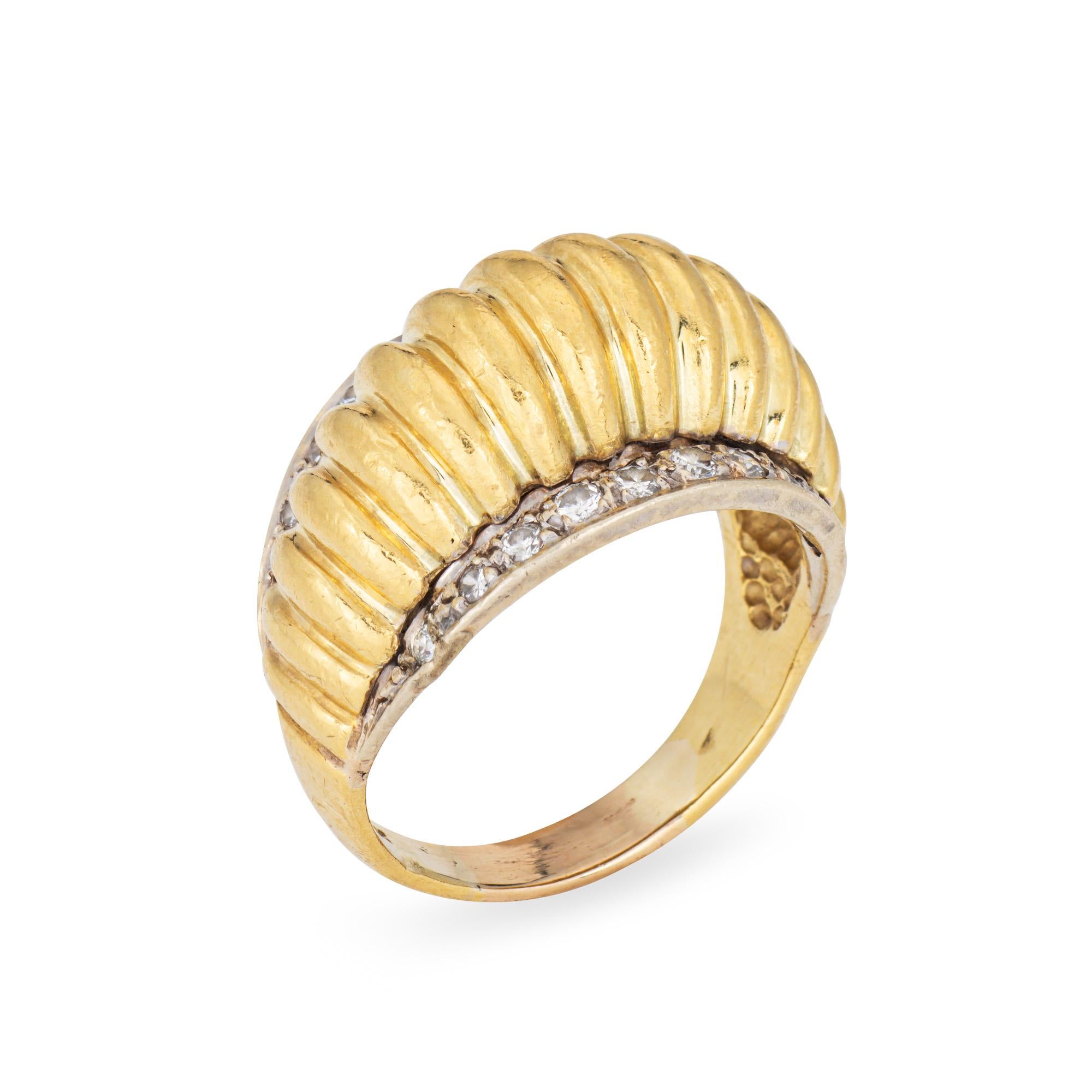 Stylish vintage fluted diamond dome ring (circa 1980s) crafted in 18 karat yellow gold. 

Diamonds total an estimated 0.25 carats (estimated at H-I color and SI1-I1 clarity).  

The ribbed dome ring is accented with diamonds to both sides. The