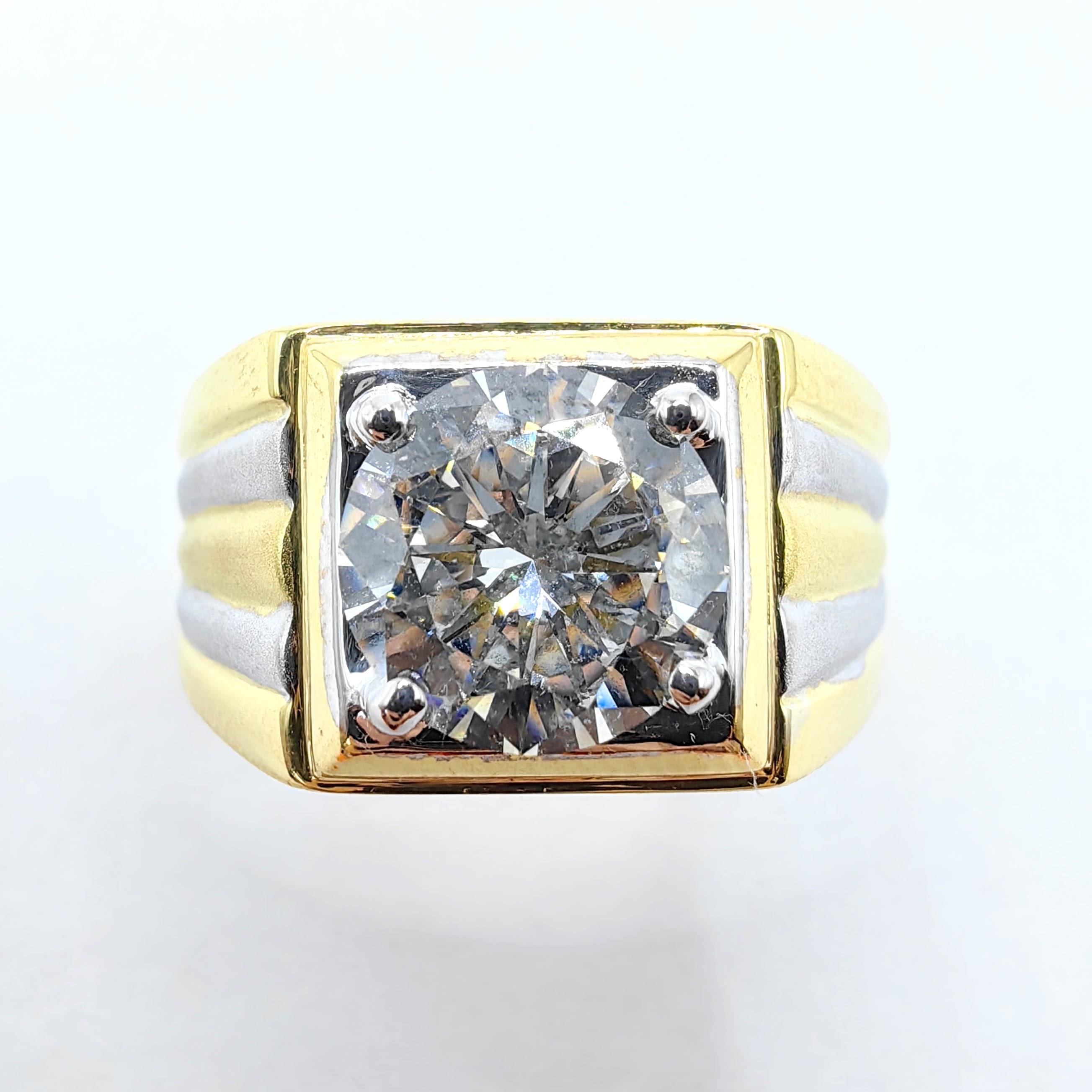 Introducing our vintage GIA 1.69 Carat Men's Round Cut Diamond Ring in 18k Two-Tone Gold, a timeless symbol of sophistication and masculine style from the 1980s. This exquisite men's ring is crafted with meticulous attention to detail, showcasing a