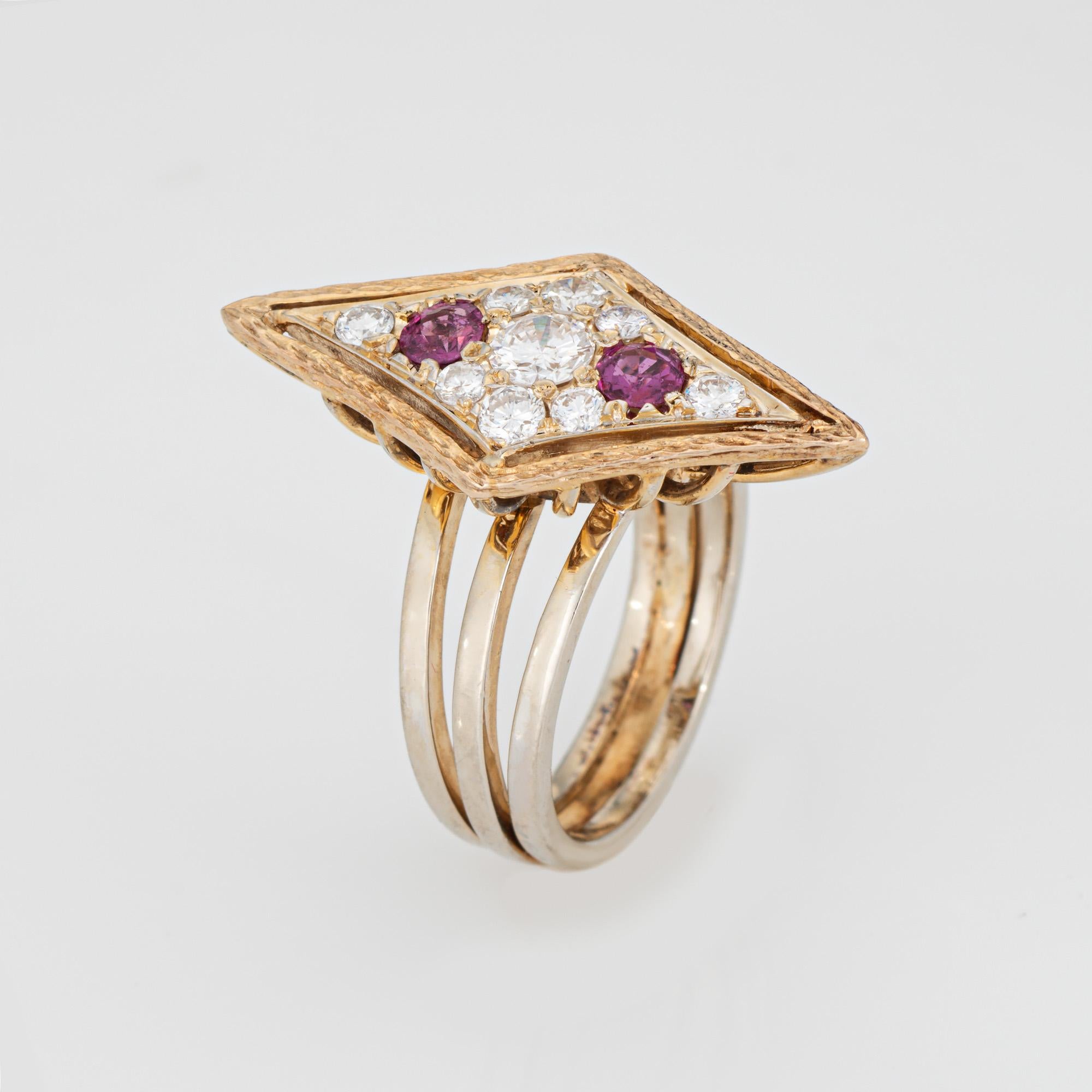 Stylish vintage diamond 7 ruby cocktail ring (circa 1980s) crafted in 14 karat yellow gold. 

Diamonds total an estimated 0.30 carats (estimated at I-J color and VS1-SI2 clarity). Rubies measure approx. 3mm each. 

The stylish geometric ring