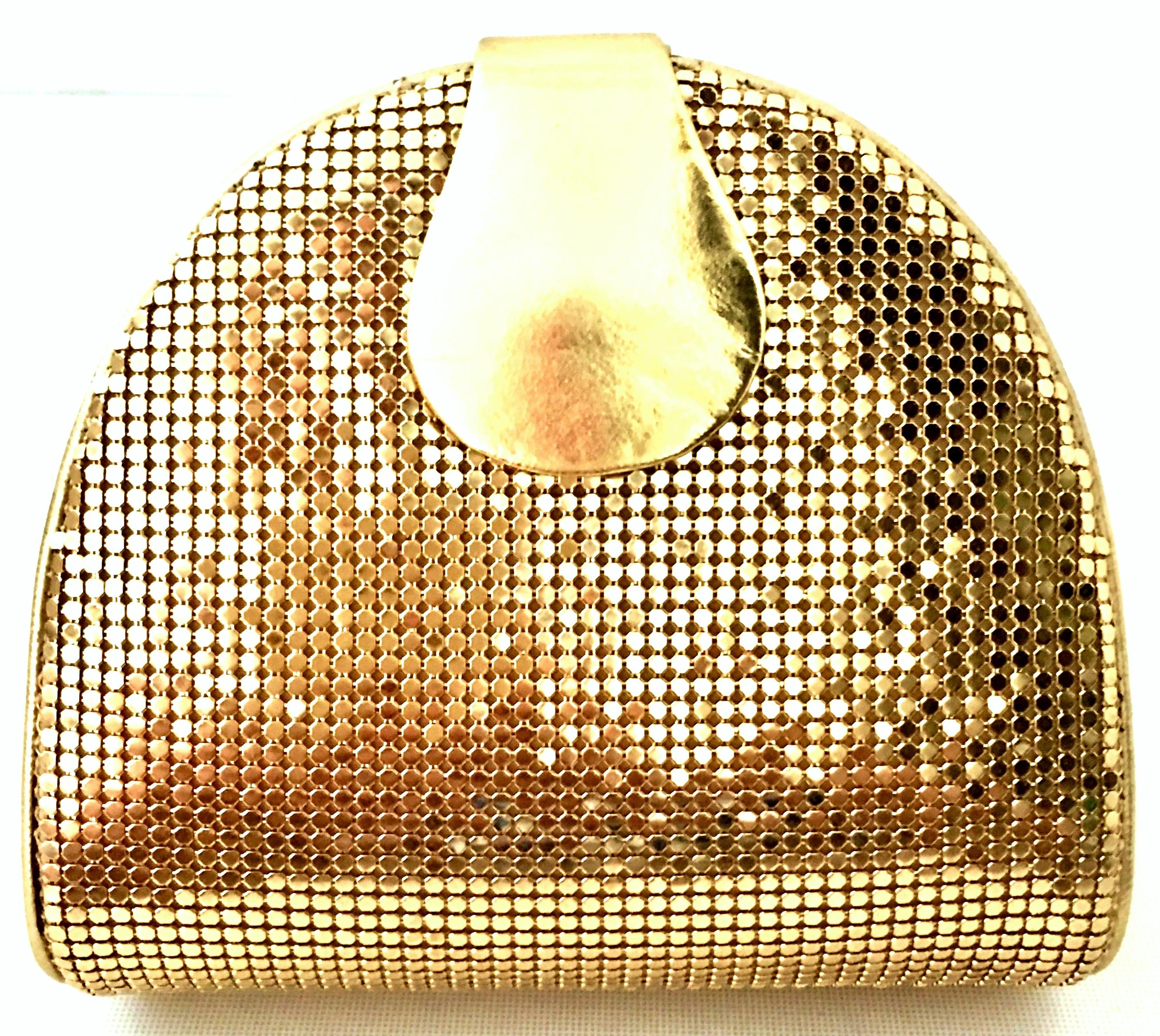 20th Century Whiting & Davis Gold Metal Mesh & Gold Metallic Leather Hand Bag. This unique hard sided clutch, cross boy or shoulder hand bag features a gold plate chain link shoulder strap that can be tucked in when not in use. The gold chain link