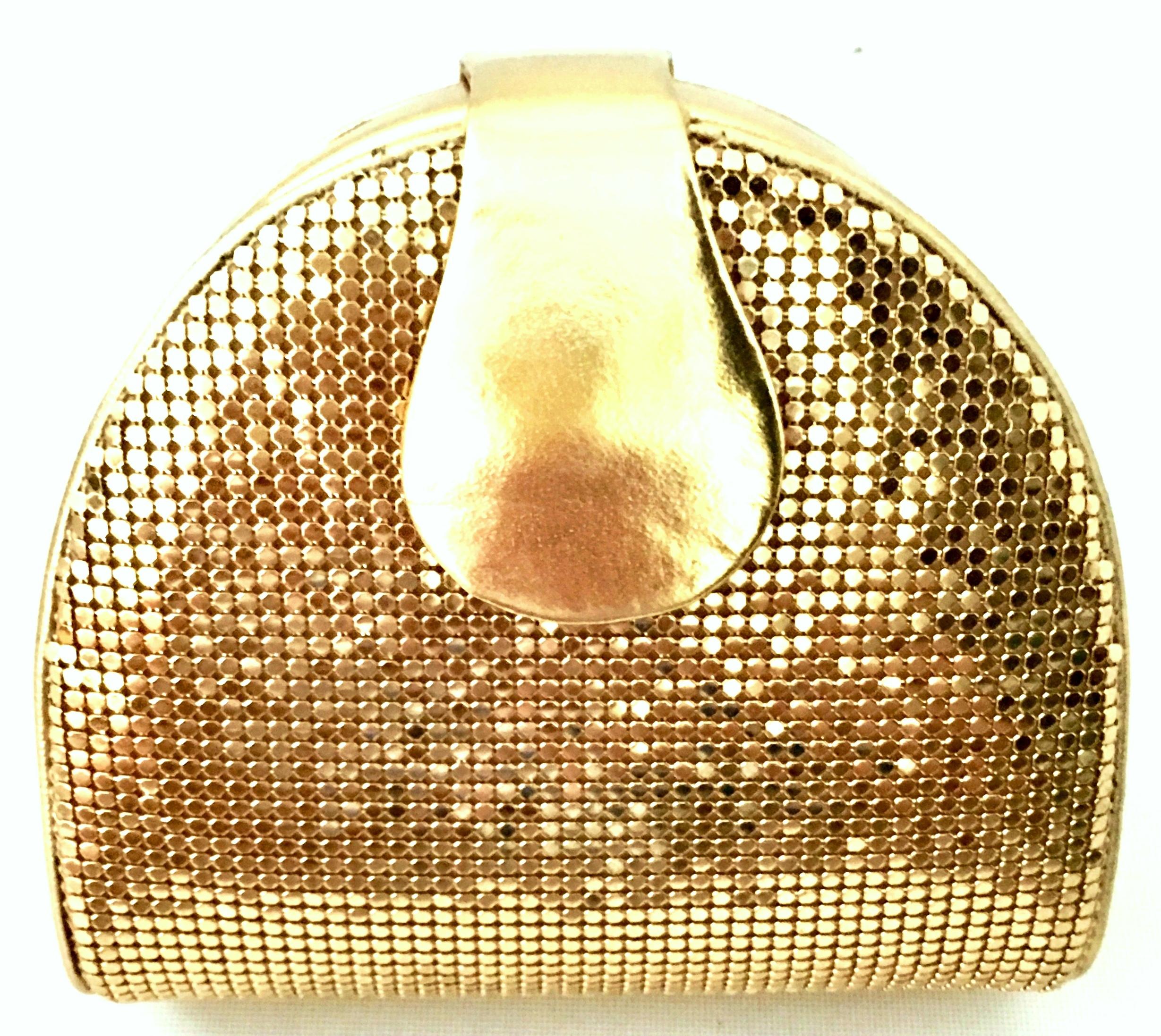 Vintage Whiting & Davis Gold Metal Mesh & Gold Metallic Leather Hand Bag. This unique hard sided clutch, cross boy or shoulder hand bag features a gold plate chain link shoulder strap that can be tucked in when not in use. The gold chain link