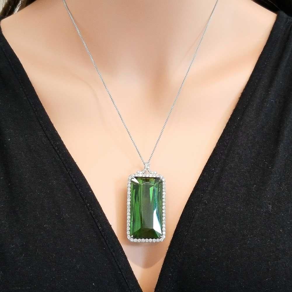 Add a massive pop of color and elevate your look. This stunning pendant features a stately 81.0 carat - 34 x 18.50 millimeter green tourmaline. This gem comes from Brazil. The size of the gemstone is noteworthy. The purity and transparency are