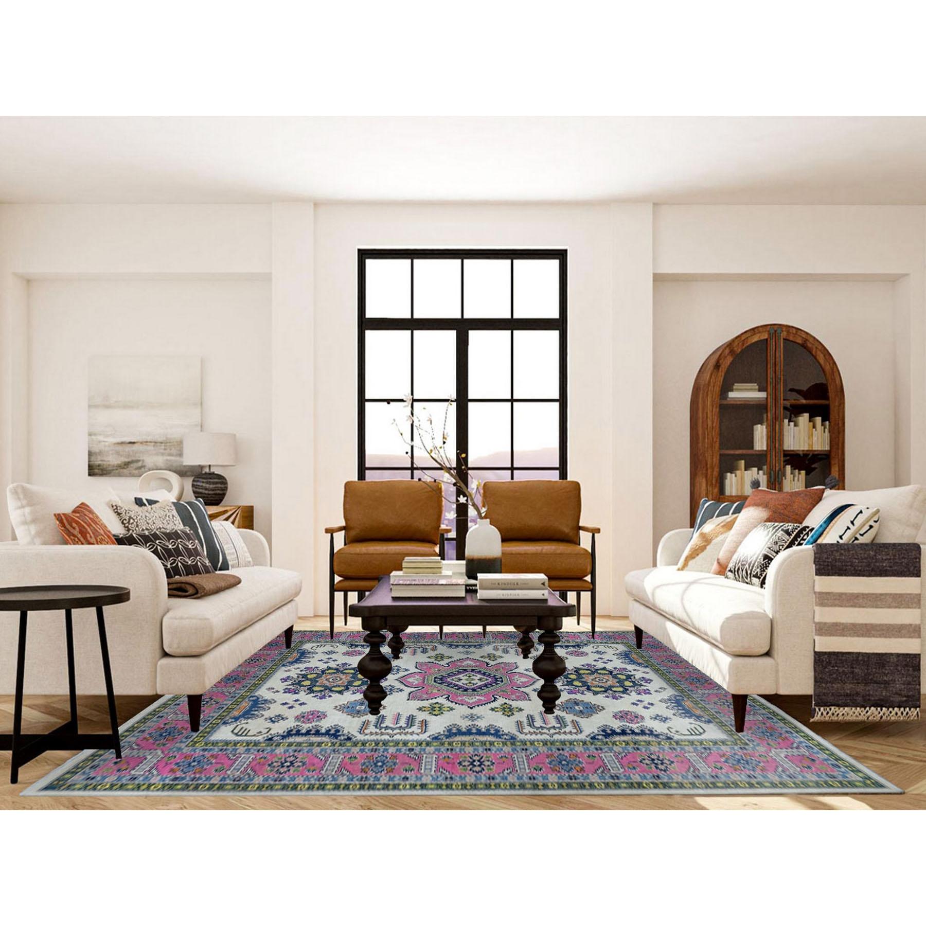 This is a truly genuine one-of-a-kind Colorful Ivory Fusion Kazak Natural Wool Hand Knotted Oriental Rug. It has been Knotted for months and months in the centuries-old Persian weaving craftsmanship techniques by expert artisans.
Primary materials: