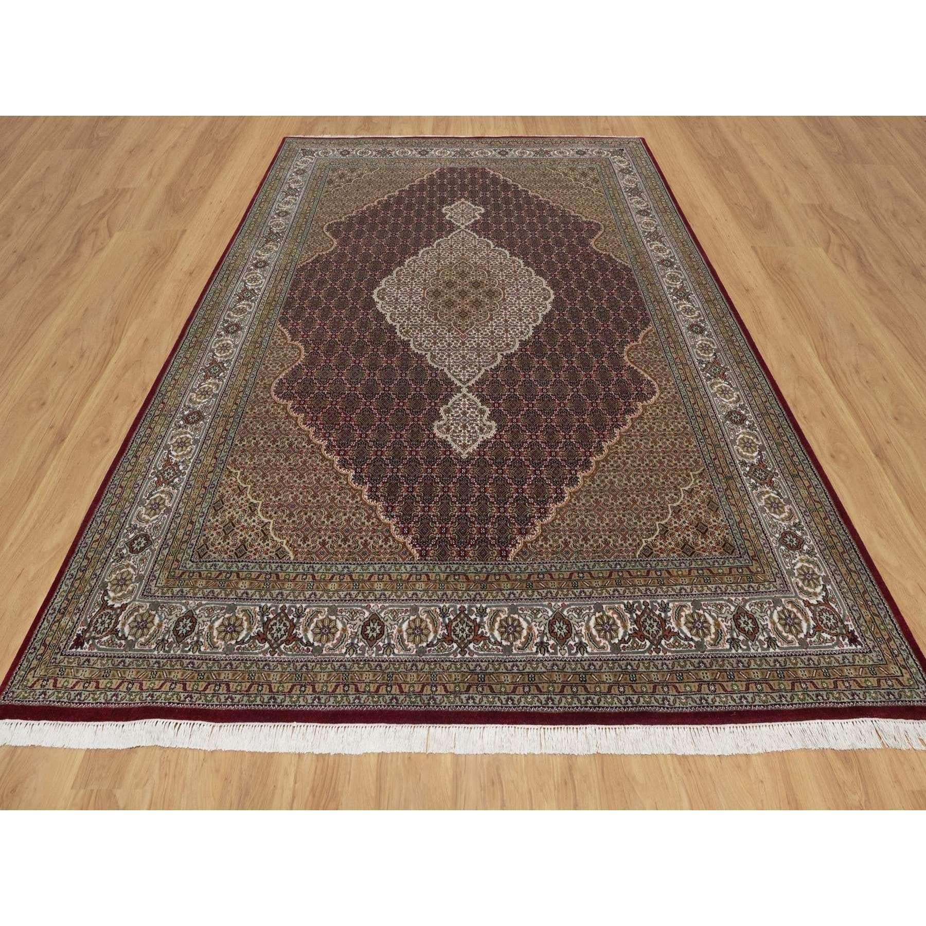 Ruby Red, Tabriz Mahi with Fish Medallion Design, 100% Wool, Hand Knotted, 175 KPSI, Oriental Rug
Primary materials: Wool
Latex: No Pile 
height: 0.25 Inches
Style: Traditional
Primary color: Red
Secondary colors: Brown, Green, Light Blue
Pattern: