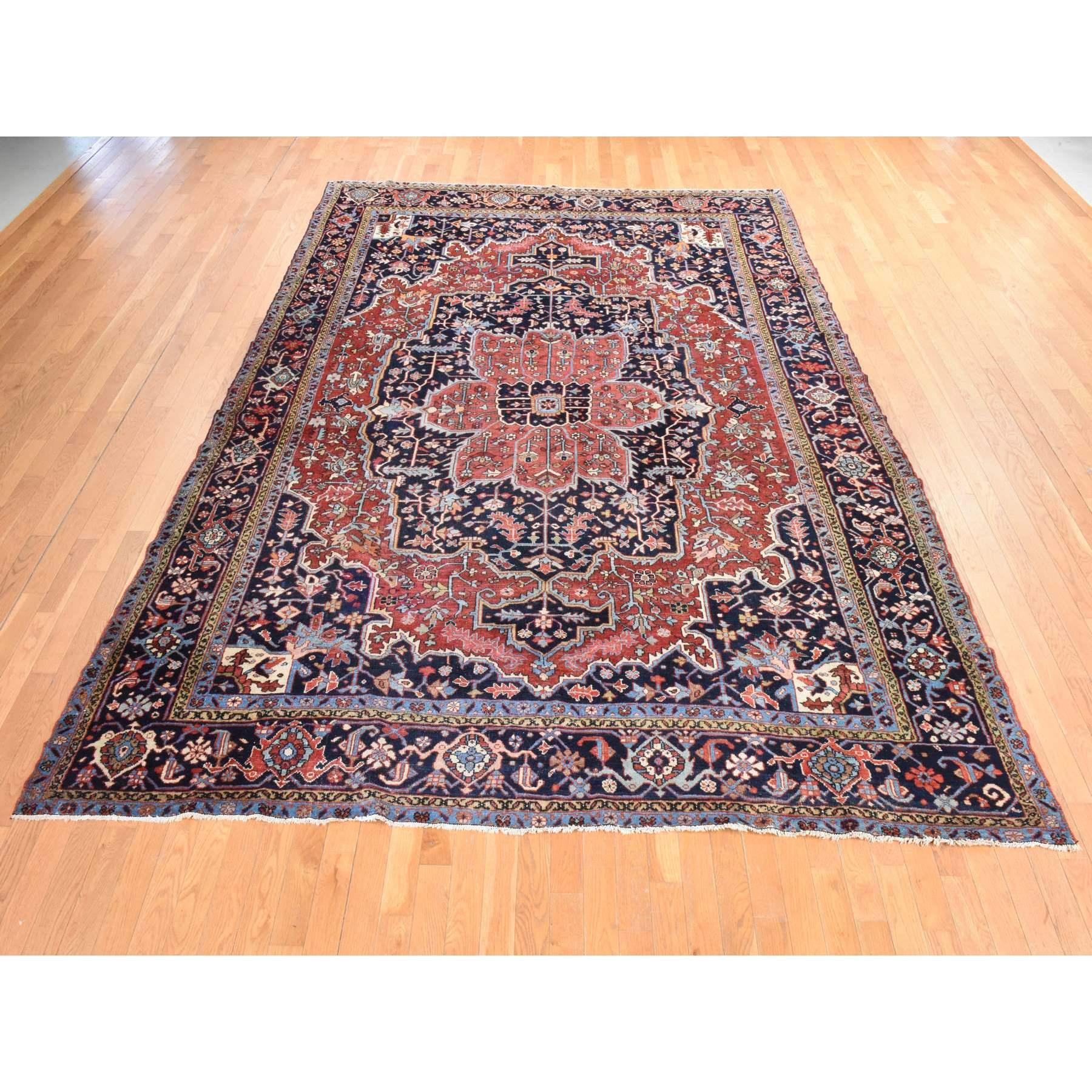 Samba Red, Antique Persian Heriz, Clean, Even Wear, Large Medallion Design, 100% Wool, Hand Knotted, Oriental Rug
Primary materials: Wool
Latex: No Pile 
height: 0.25 Inches
Style: Traditional
Primary color: Red
Secondary colors: Light Blue, Beige,