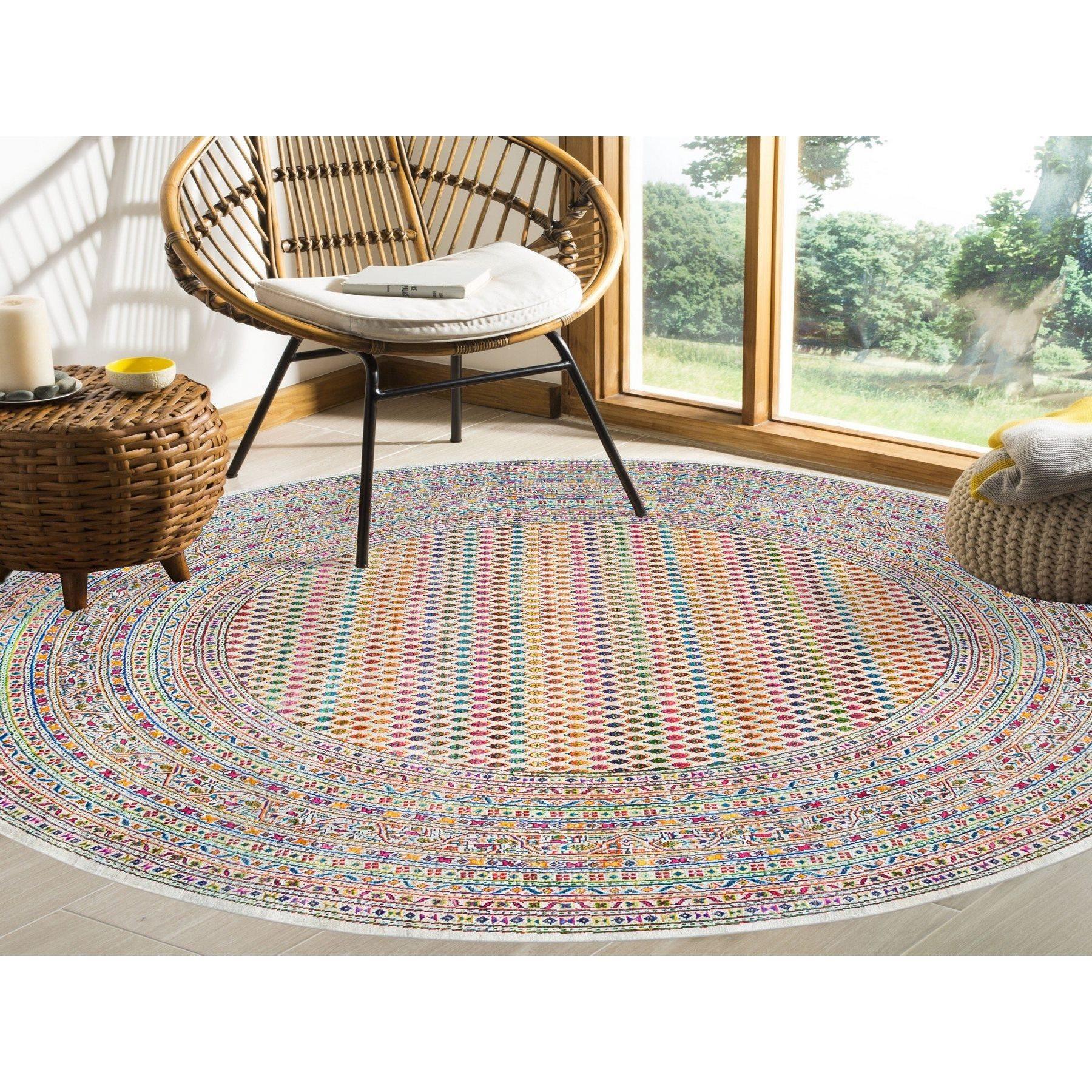 This is a truly genuine one-of-a-kind Colorful Wool And Sari Silk Sarouk Mir Inspired With Repetitive Boteh Design Hand Knotted Oriental Round Rug. It has been Knotted for months and months in the centuries-old Persian weaving craftsmanship