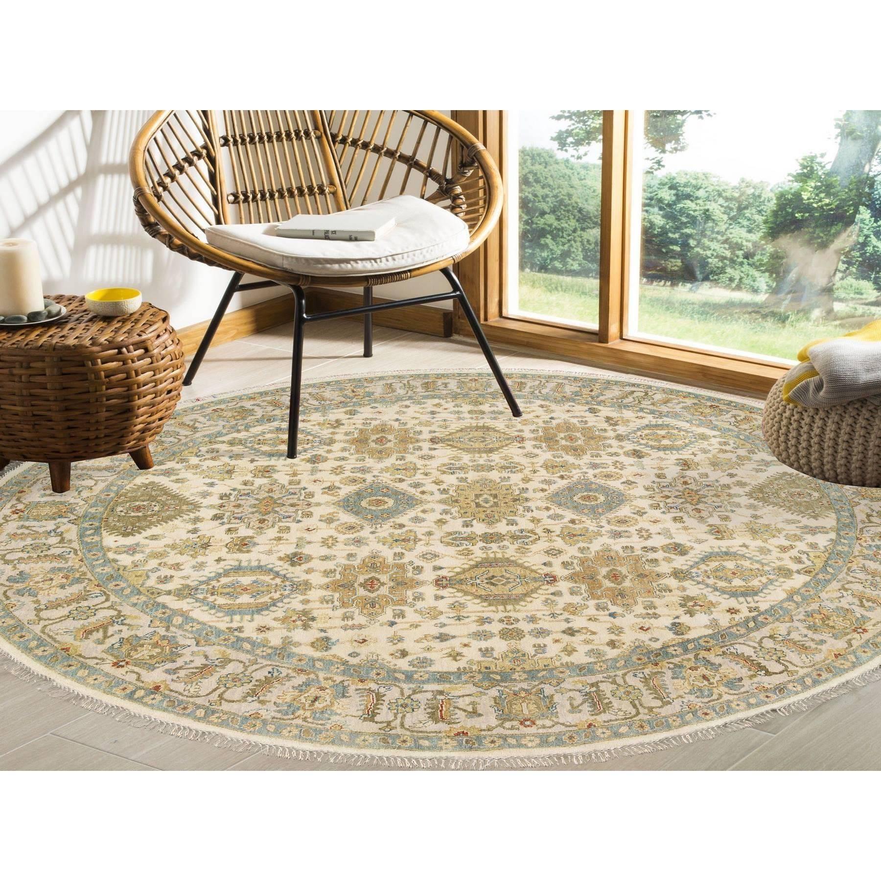 This is a truly genuine one-of-a-kind Ivory, Hand Knotted with Soft Colors, Karajeh Design, Soft Pure Wool, Oriental Round Rug. It has been Knotted for months and months in the centuries-old weaving craftsmanship techniques by expert
