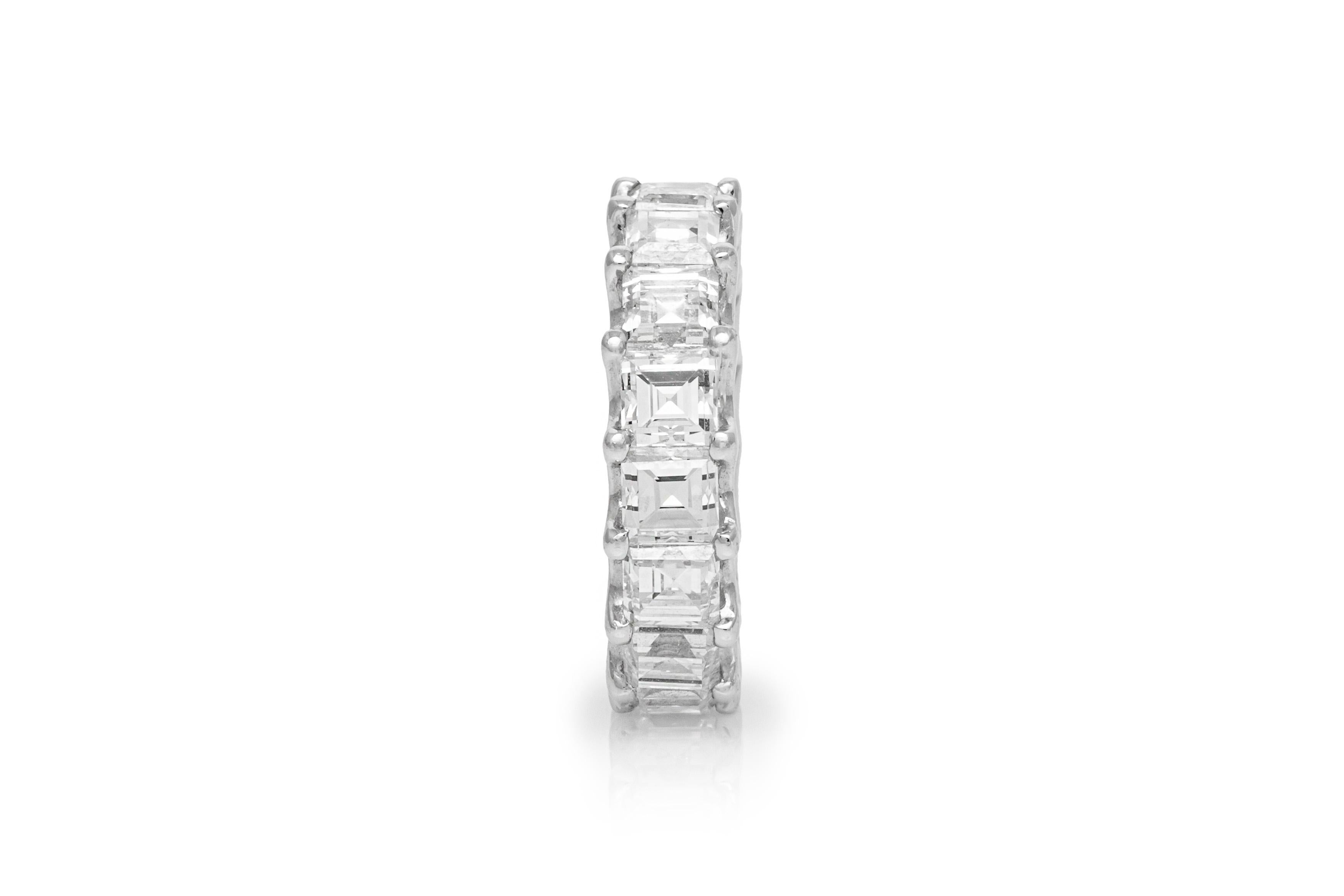 Estate Platinum Eternity Ring features 16 beautifully matched square emerald cut diamonds, weighing a total of 8.12 carats. Ring Size 5.5. May be sized upon request. Additional charges may apply.  Circa 1990's.

