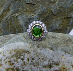8.12ct Oval Tsavorite Garnet and Diamond Cluster Ring in 18K Gold