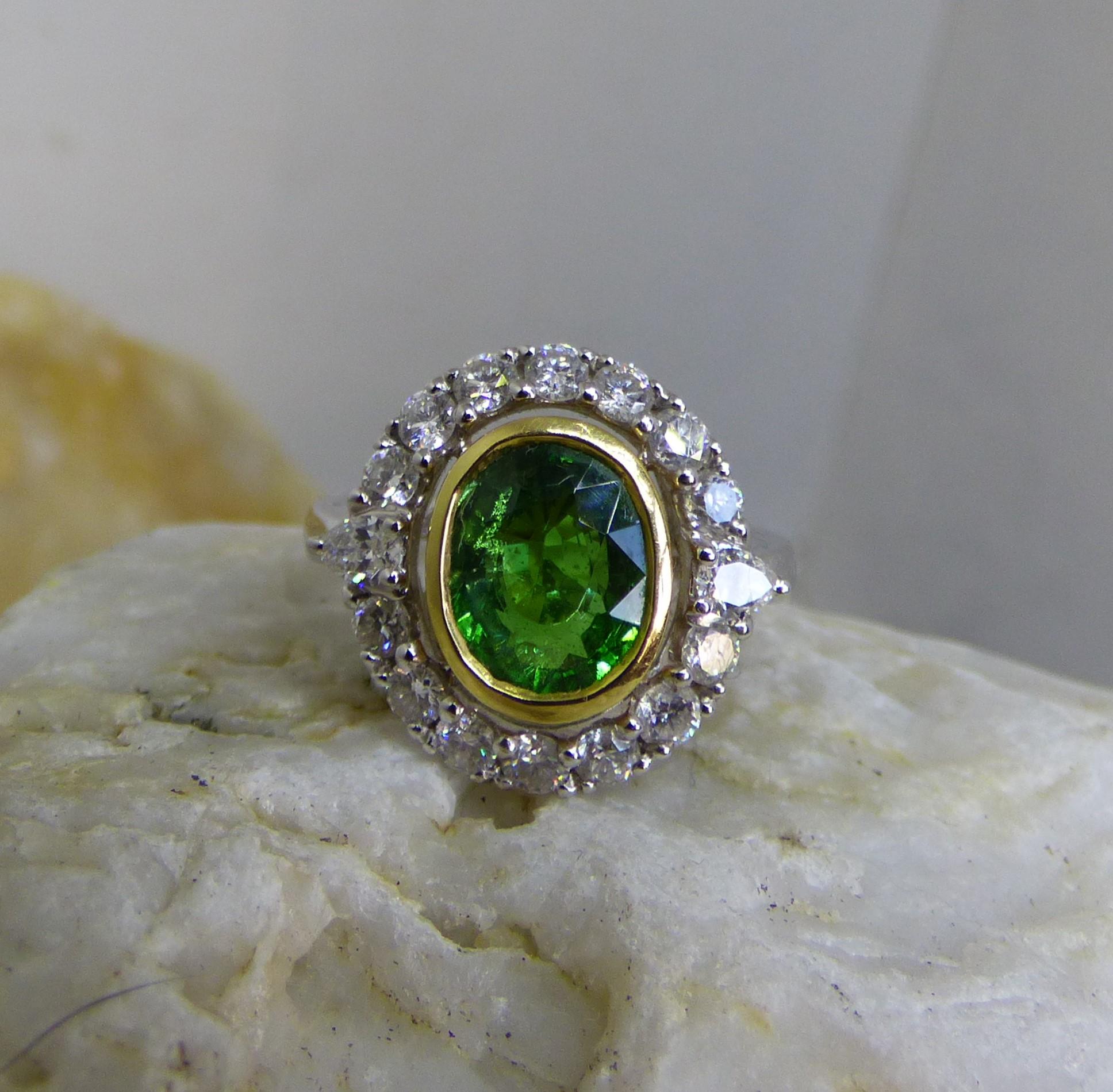 Oval Cut 8.12ct Oval Tsavorite Garnet and Diamond Cluster Ring in 18K Gold For Sale