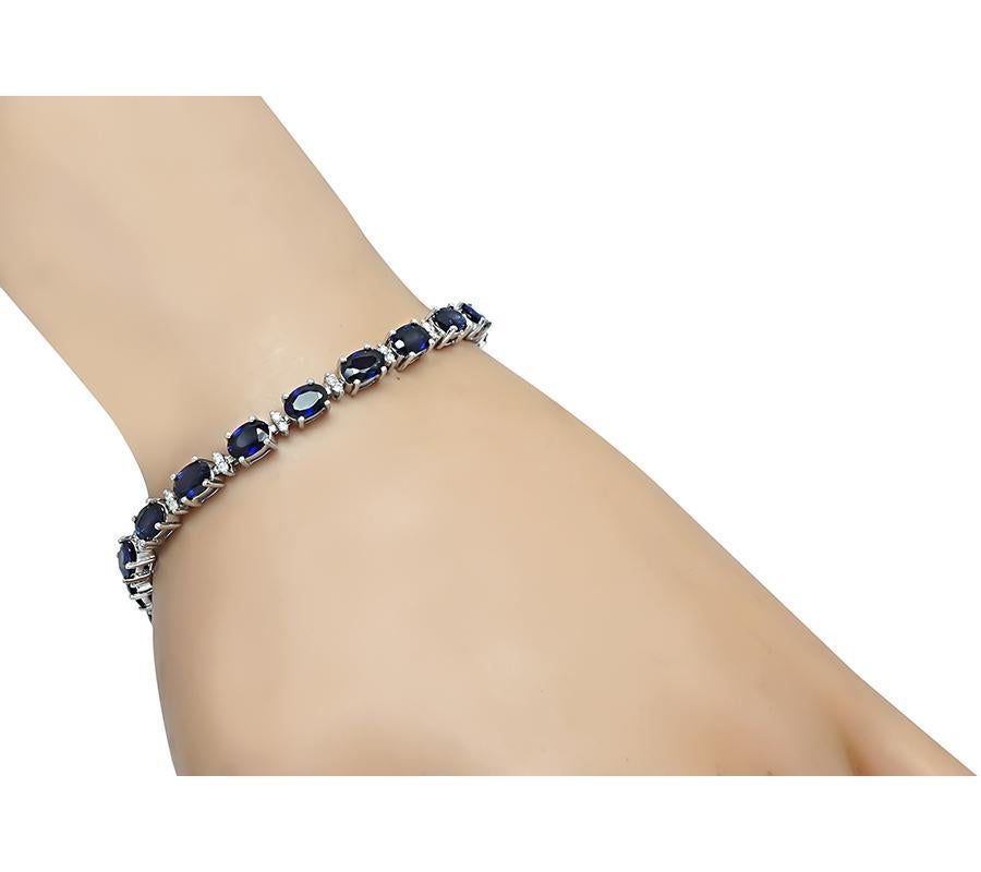 This is a charming 18k white gold bracelet. The bracelet is set with lovely oval cut sapphires that weigh approximately 8.13ct. The sapphires are accentuated by sparkling round cut diamonds that weigh approximately 0.50ct. The color of these