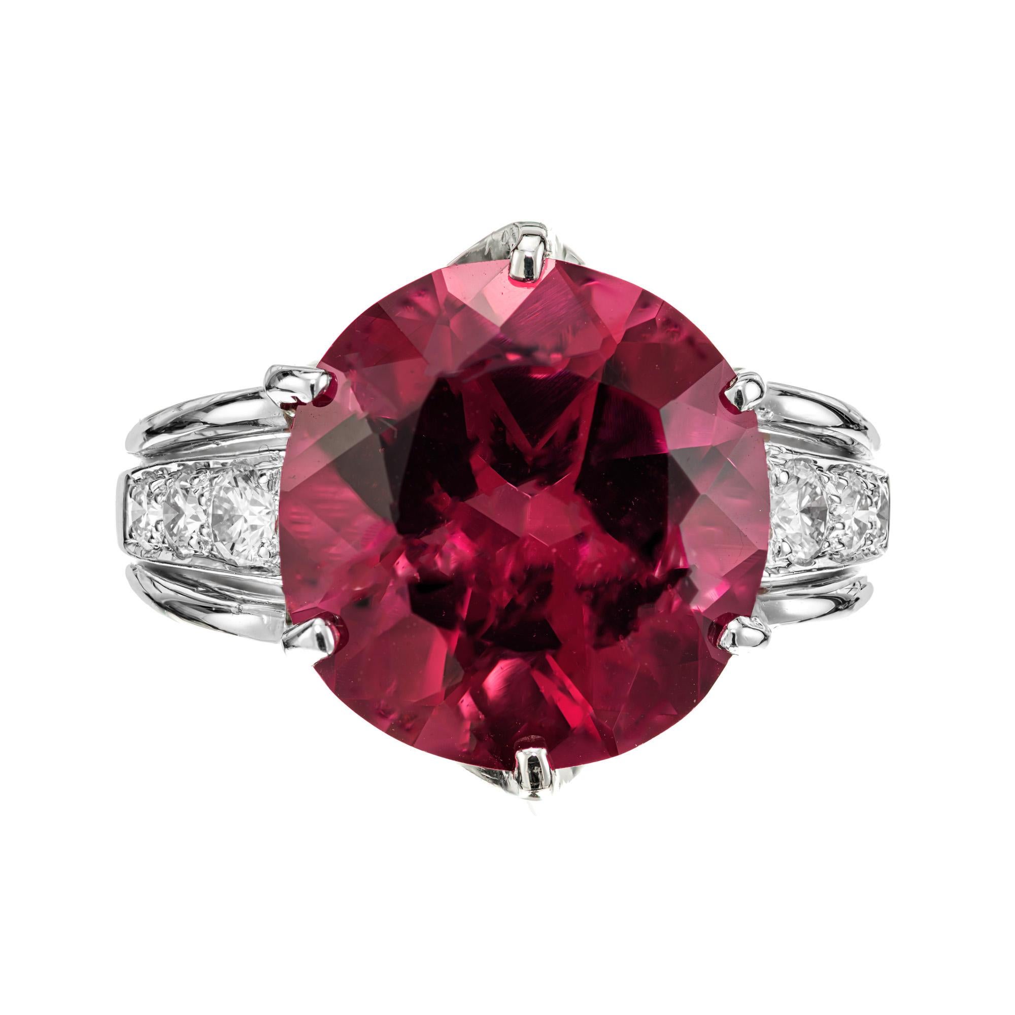 Bright pink rubelite tourmaline diamond platinum ring. Large 8.14ct round center tourmaline in its original 1950's six prong platinum setting with 6 round accent diamonds. 

One round deep reddish pink rubellite tourmaline, approx. total weight