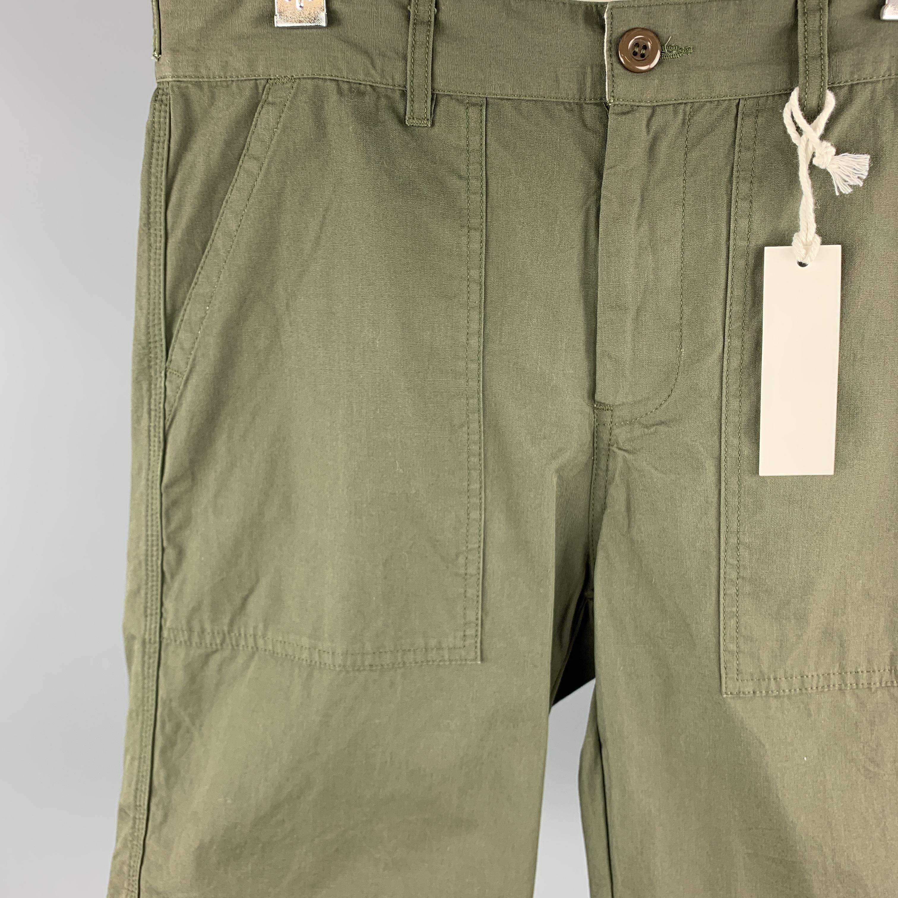 8. 15 AUGUST FIFTEENTH shorts comes in a olive cotton featuring front patch pockets and a zip fly closure. Made in USA.

New With Tags.
Marked: 32 in. 

Measurements:

Waist: 32 in. 
Rise: 9.5 in. 
Inseam: 11.5 in. 