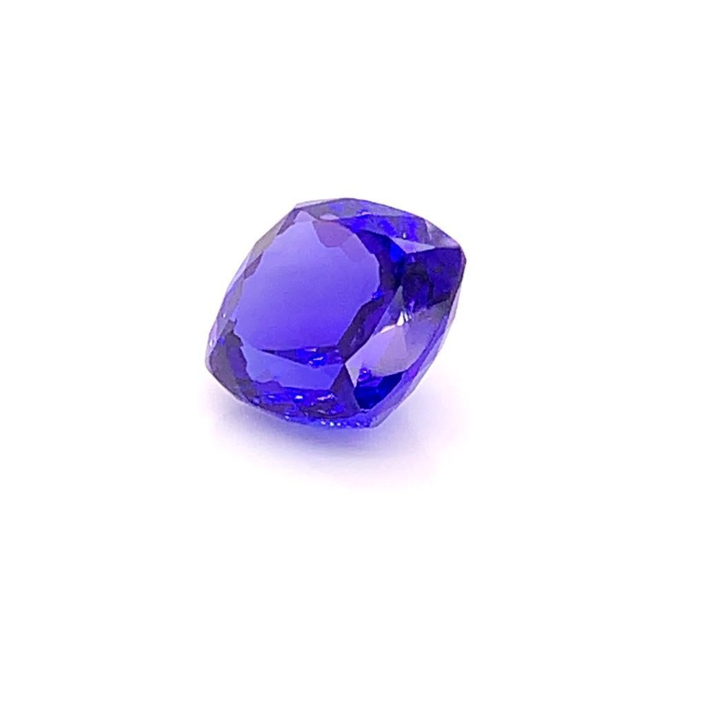This Spectacular Cushion cut tanzanite is a gorgeous striking blue with the slightest hints of violet and bronze. Flawlessly cut, this gem measures approximately 11.8mm by 11.2mm by 7.2mm and weighs approximately 8.15 Carats. The depth of colour of