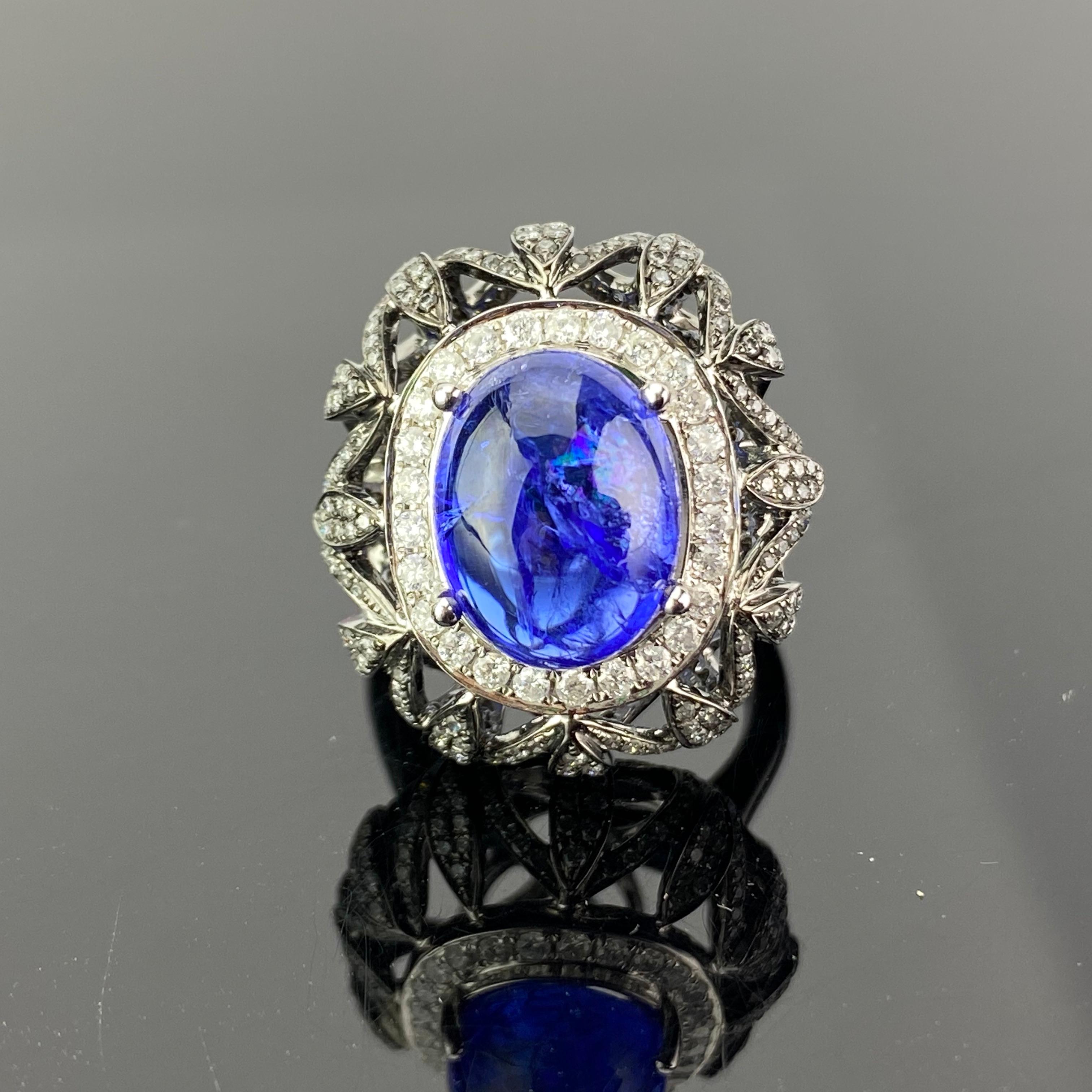 A one of a kind cocktail ring, featuring a transparent, full of luster 8.16 carat natural Tanzanite. 1.80 carats of White Diamonds are used, and a mix of 13.81 grams of white gold and black rhodium plated gold makes this ring very unique. Currently
