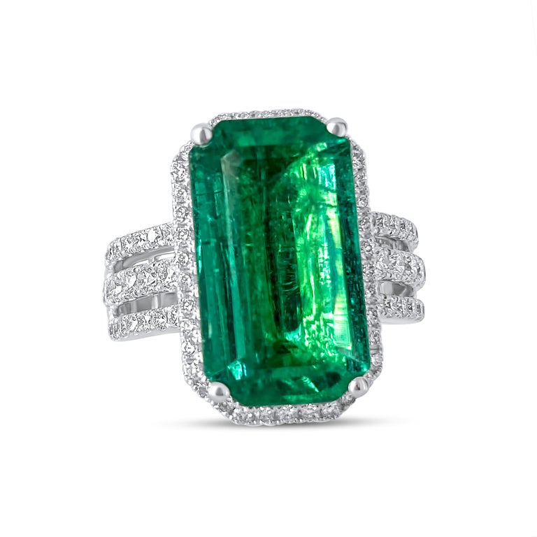 Make a statement with this significant Emerald of over 8 cts feature in a trinity style brilliant cut diamond ring. Renowned for our one of a kind precious gemstone collection, this ring is the star of our holiday collection! Wear it as a cocktail