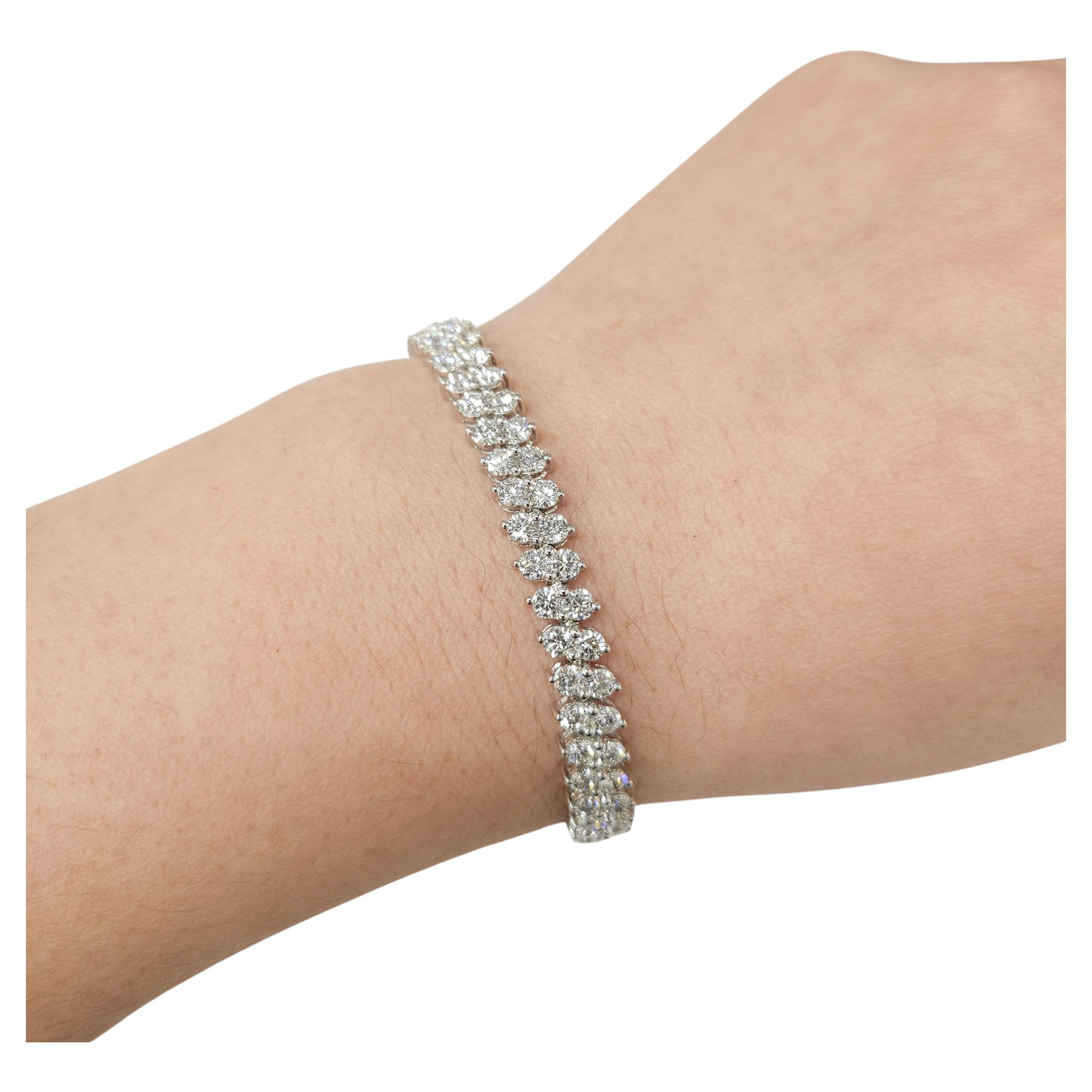 Enhance your wrist with the luxurious beauty of this exquisite 8.18 Carat Total Round Diamond Tennis Bracelet. Meticulously crafted in 18K white gold, this bracelet boasts a stunning double row design, epitomizing elegance and sophistication.

The