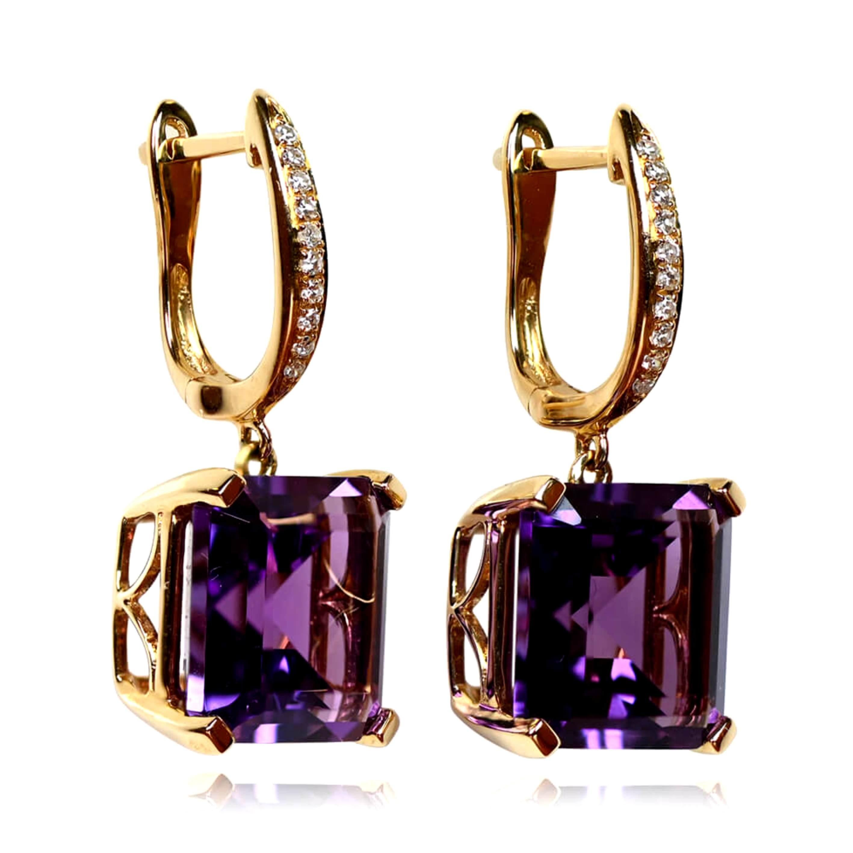 Adorn yourself with the captivating beauty of these gemstone earrings, showcasing emerald-cut amethysts weighing a total of 8.18 carats. Set in 18k yellow gold baskets, the amethysts take center stage, exuding a regal and vibrant allure. The