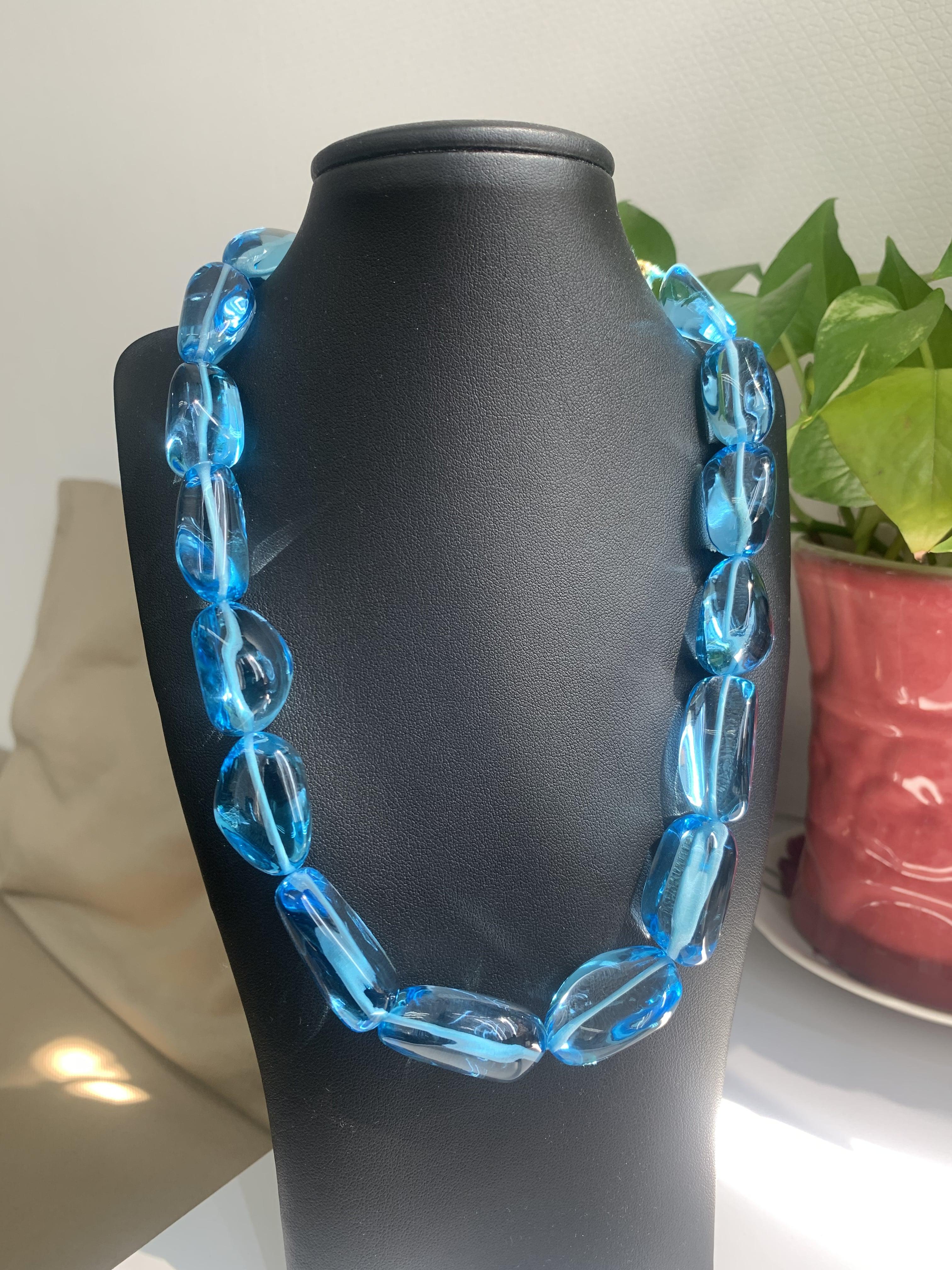 Introducing our exquisite Blue Topaz Necklace, a captivating piece that effortlessly combines elegance and timeless beauty. This necklace showcases 819 Carat of stunning blue topaz gemstones, that radiate mesmerizing hue of a bold and beautiful