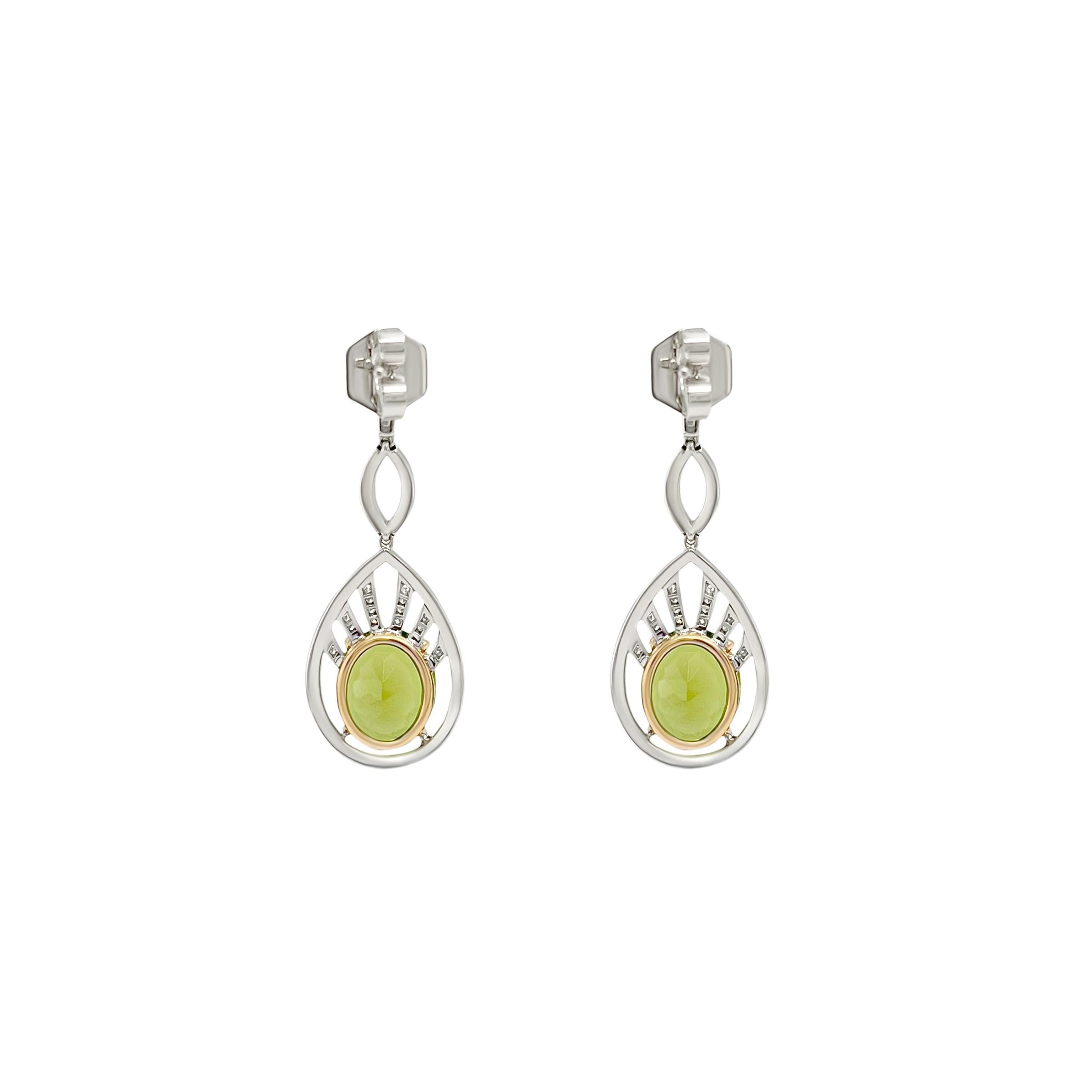 These natural 8.19ct peridot earrings show off their vibrant  green color. Completely eye clean and loupe clean these high quality peridots are combined with a sparkling diamond shield. We use top quality diamonds. The dangle design of the earrings