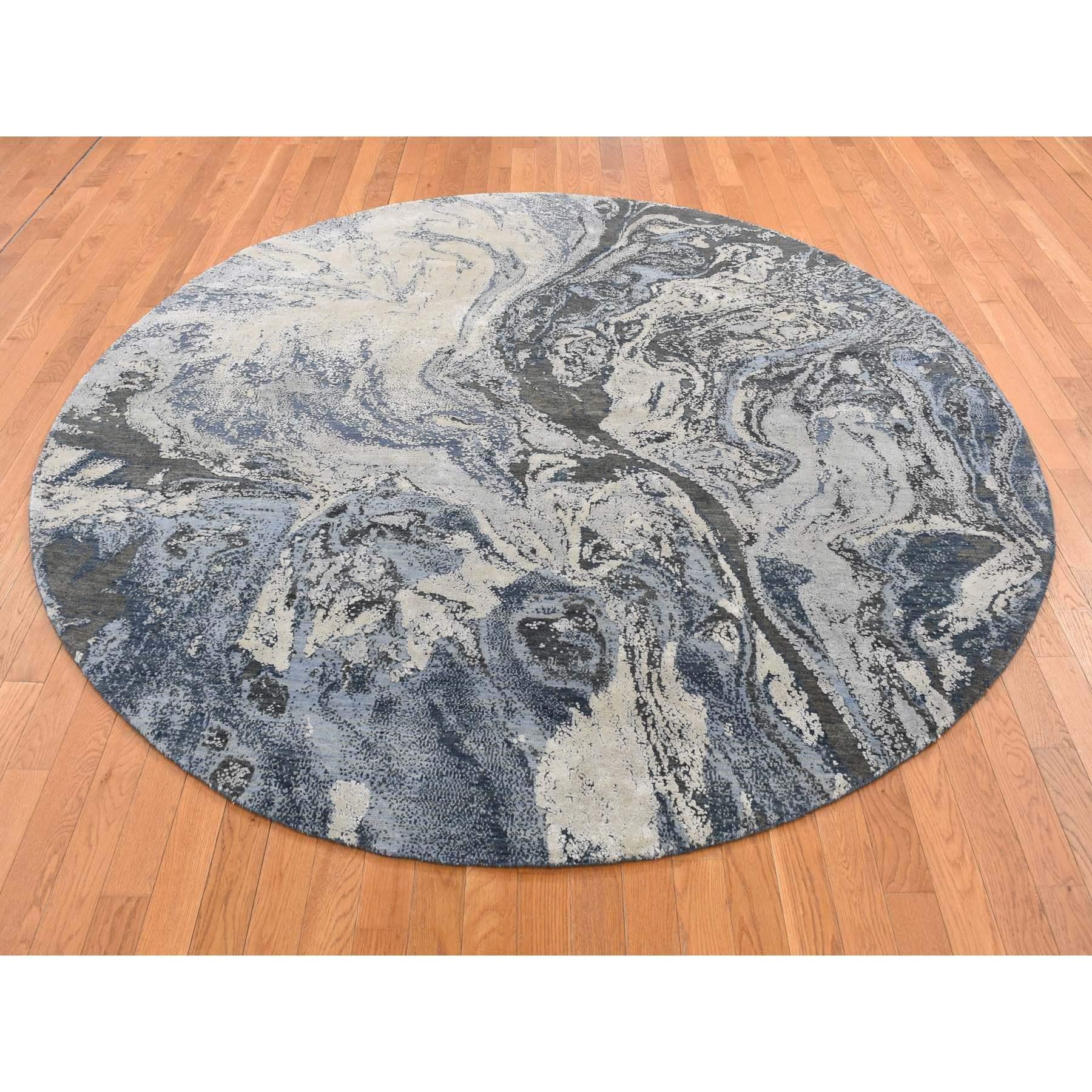 Dallas Cowboys Blue, Geological Galaxy Design, Wool and Pure Silk, Hand Knotted, Round Oriental Rug
rimary materials: Wool & Silk
Latex: No Pile 
height: 0.25 Inches
Style: Transitional
Primary color: Blue
Secondary colors: Ivory, Black, Light