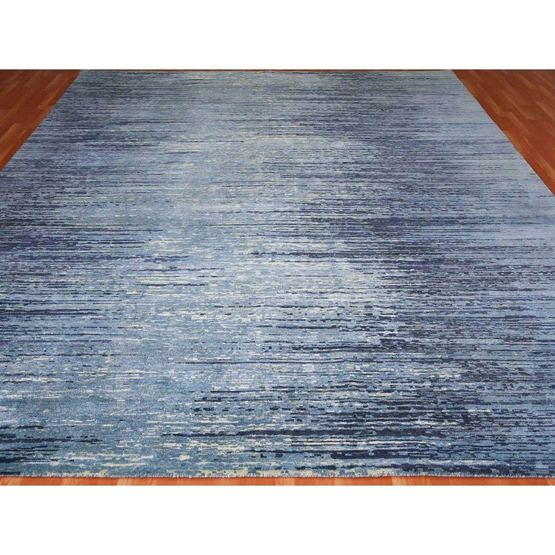 This is a truly genuine one-of-a-kind Pure Wool Horizontal Ombre Design Blue Oceanic Hand Knotted Square Oriental Rug. It has been woven for months and months in the centuries-old Persian weaving craftsmanship techniques by expert artisans.
Primary