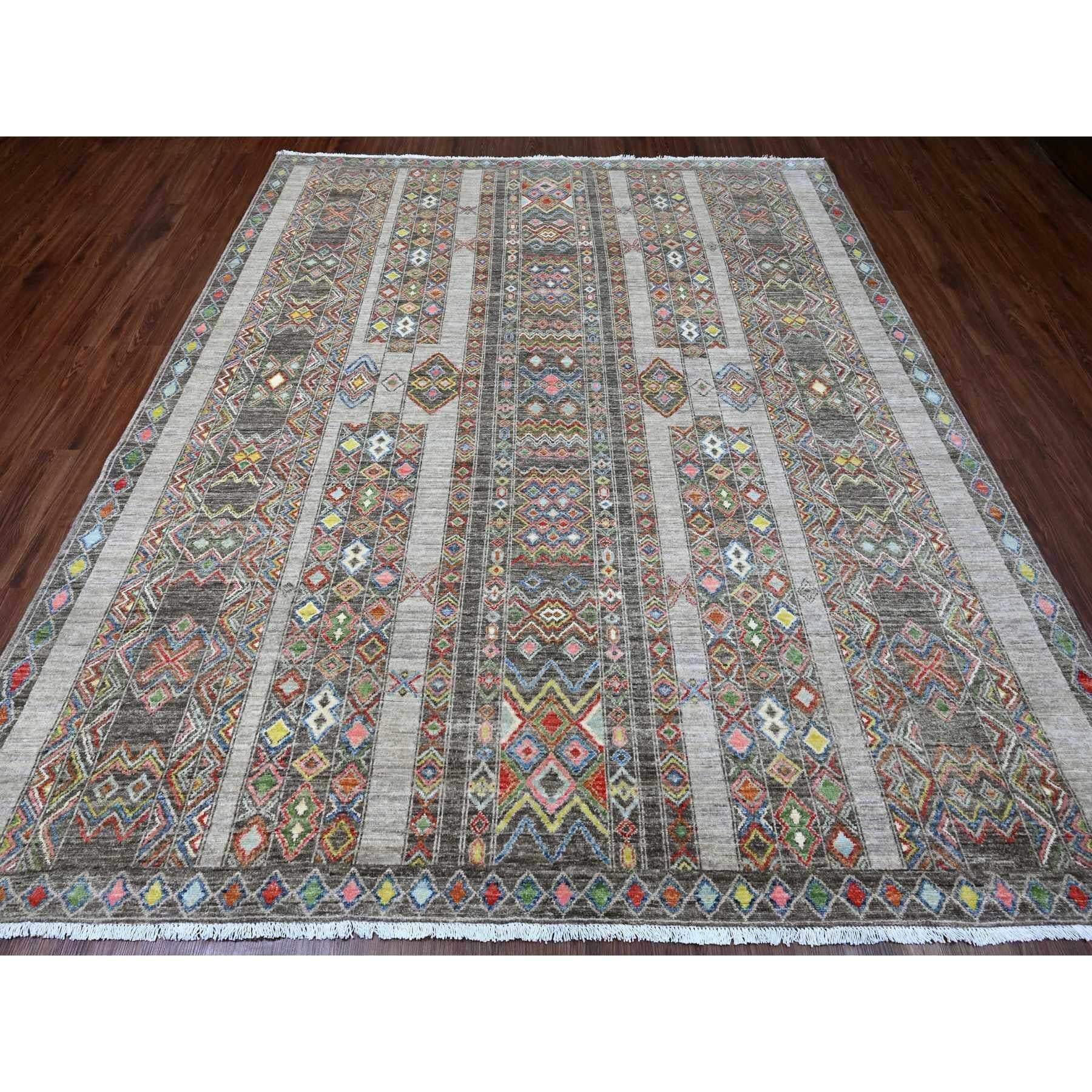 Carbon Gray, Intricate Geometric Design, Berber Influence, Denser Weave, High Mountain Wool, Hand Knotted, Oriental Rug
Primary materials: Wool
Latex: No Pile 
height: 0.25 Inches
Style: Traditional
Primary color: Grey
Secondary colors: Pink, Red,