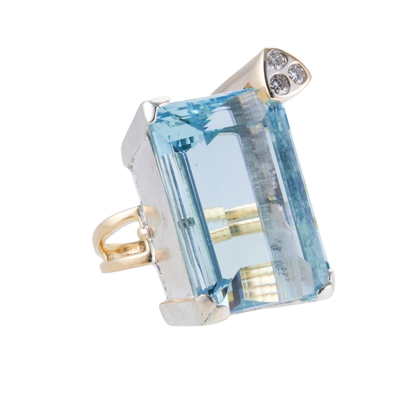 Large and impressive 18k gold cocktail ring, set with approx. 82ct aquamarine (Stone measures approx. 30mm x 21.6mm x 16.3mm, has few tiny nicks) and approx. 0.24ctw H/SI1 diamonds. Ring size 8.5, top of the ring is 37mm x 26mm. Tested 18k. Weight