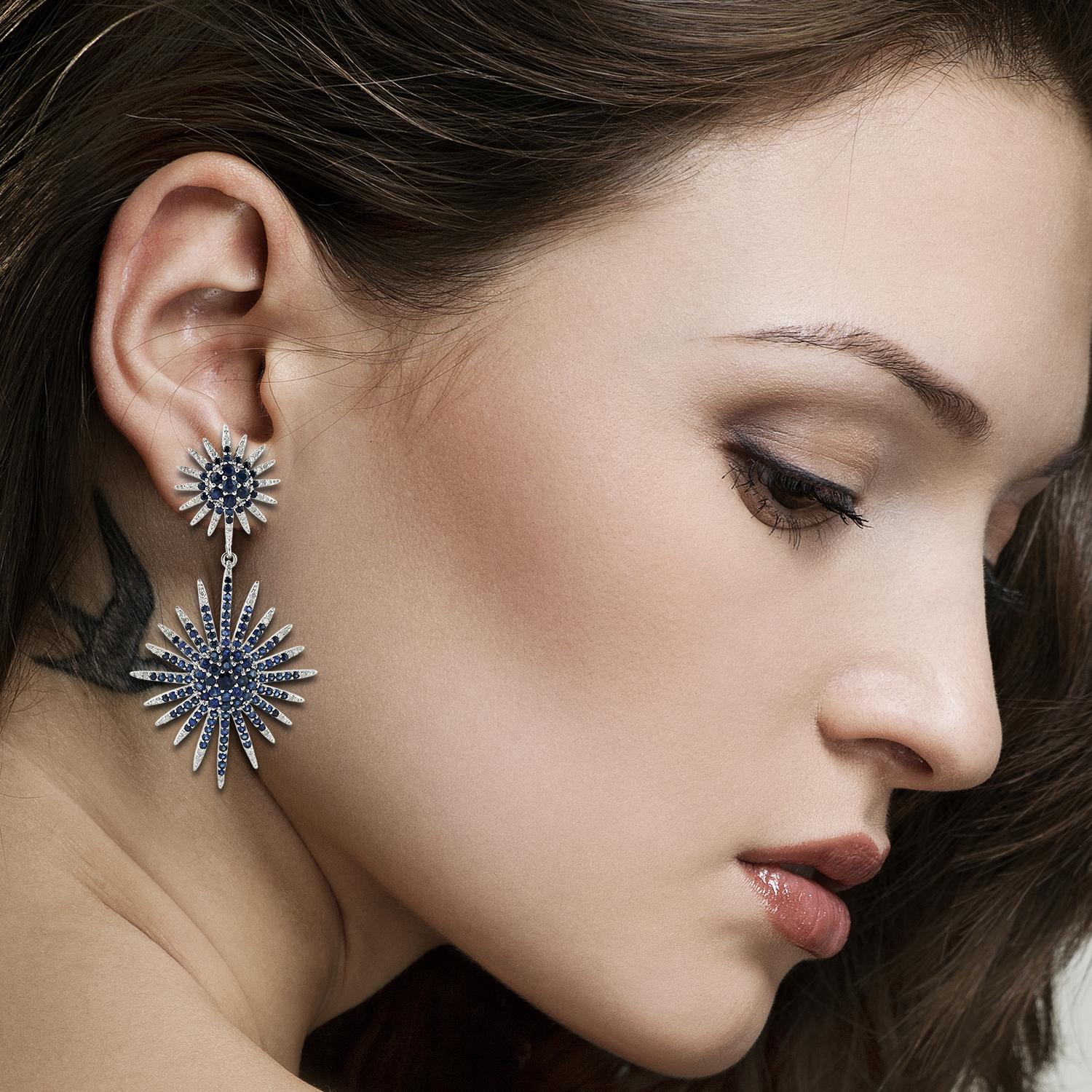 Cast in 18-karat gold & sterling silver, these stunning drop earrings are set with 8.2 carats blue sapphire and 1.16 carats of sparkling diamonds. 

FOLLOW MEGHNA JEWELS storefront to view the latest collection & exclusive pieces. Meghna Jewels is
