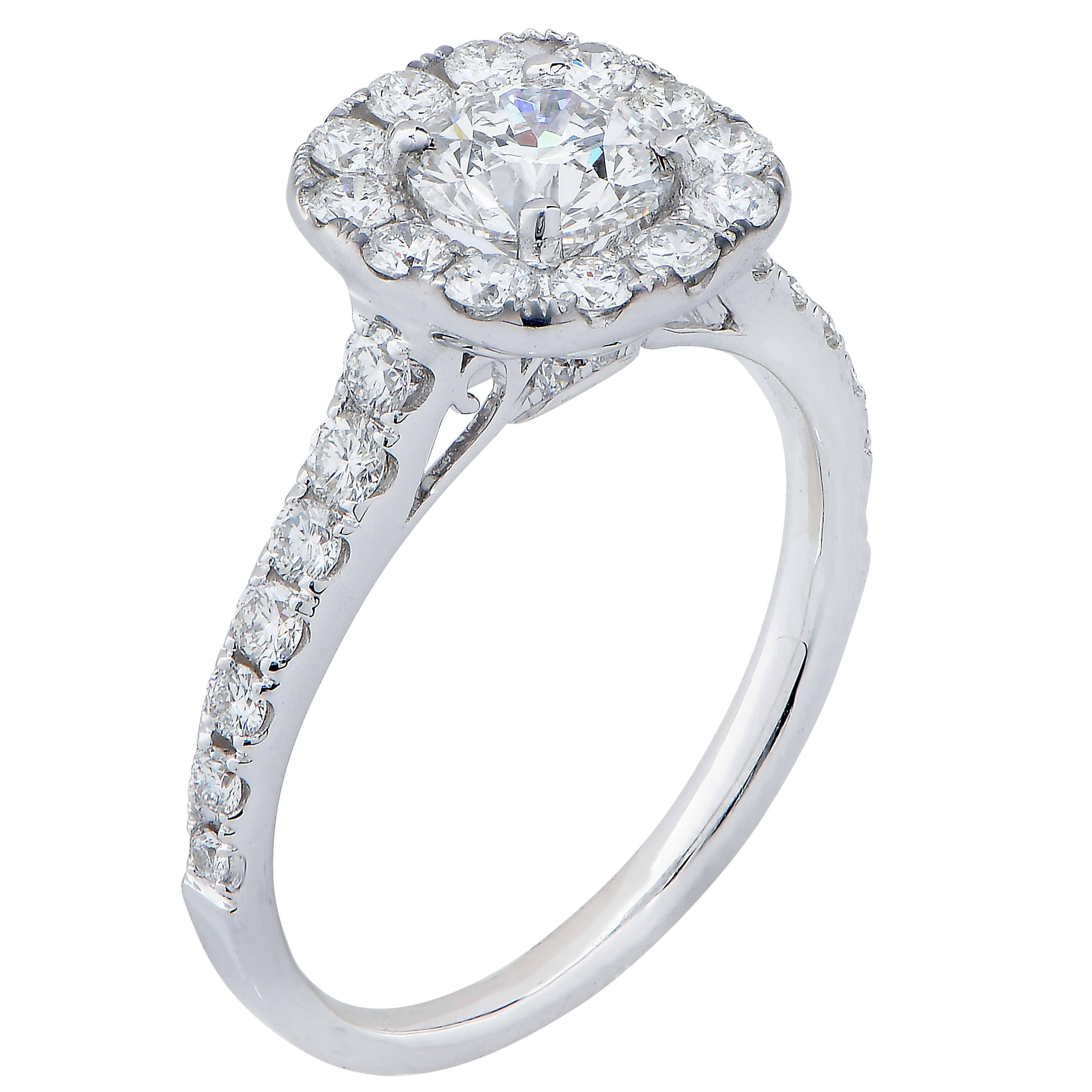 Modern design diamond engagement ring features a round brilliant cut GIA Graded E color VS2 clarity surrounded by 30 round brilliant cut diamonds with a total weight of .78 carat set in 18 Karat White Gold.
Ring Size: 6 1/2 (can be sized)
Metal