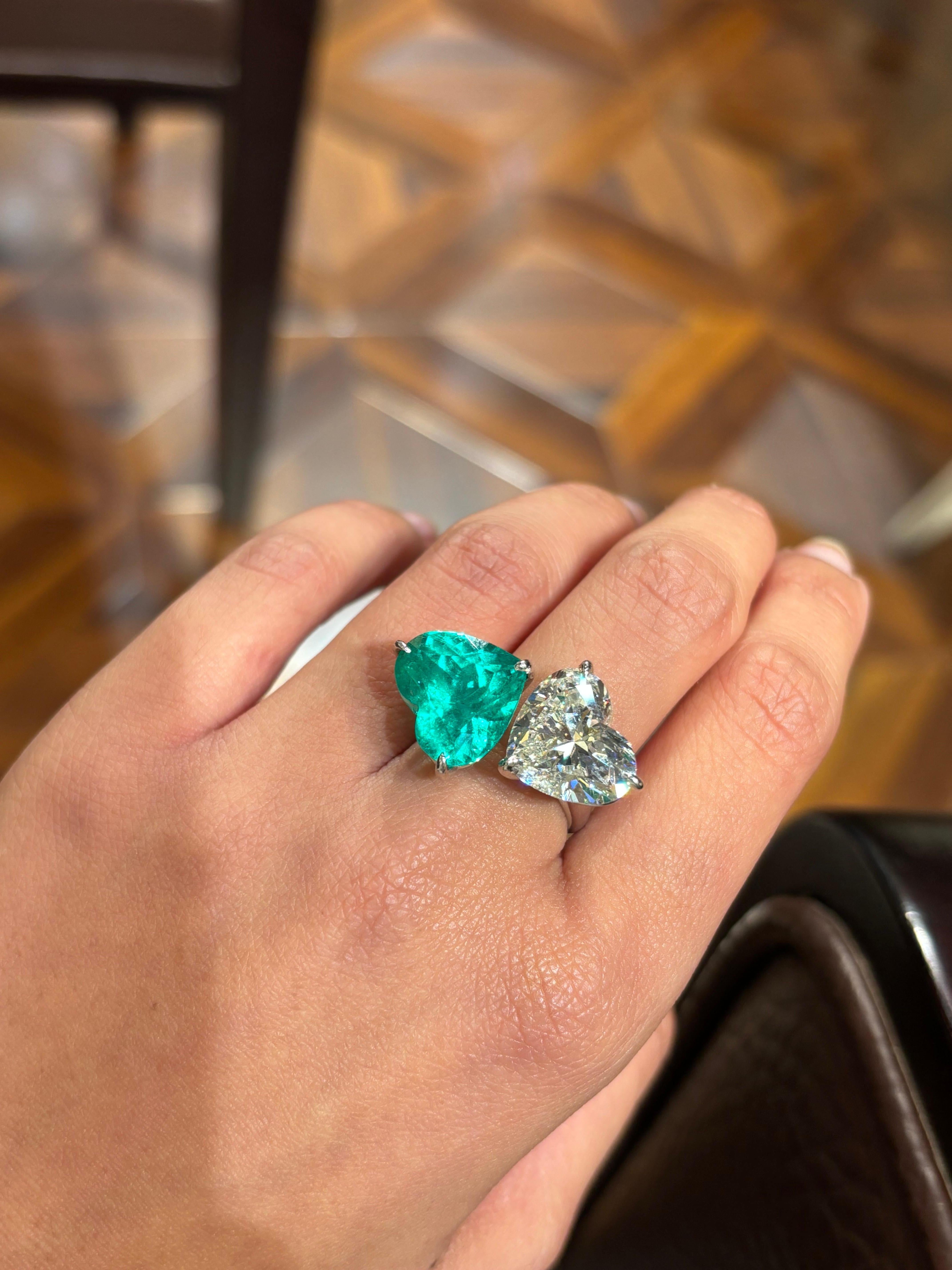 A certified 8.20 carat I color, VS2 quality heart shape White Diamond and 9.92 carat certified Colombian Emerald toi et moi cocktail ring, set in solid 18K White Gold. The stones are cut beautifully, and the Colombian Emerald is of top quality,