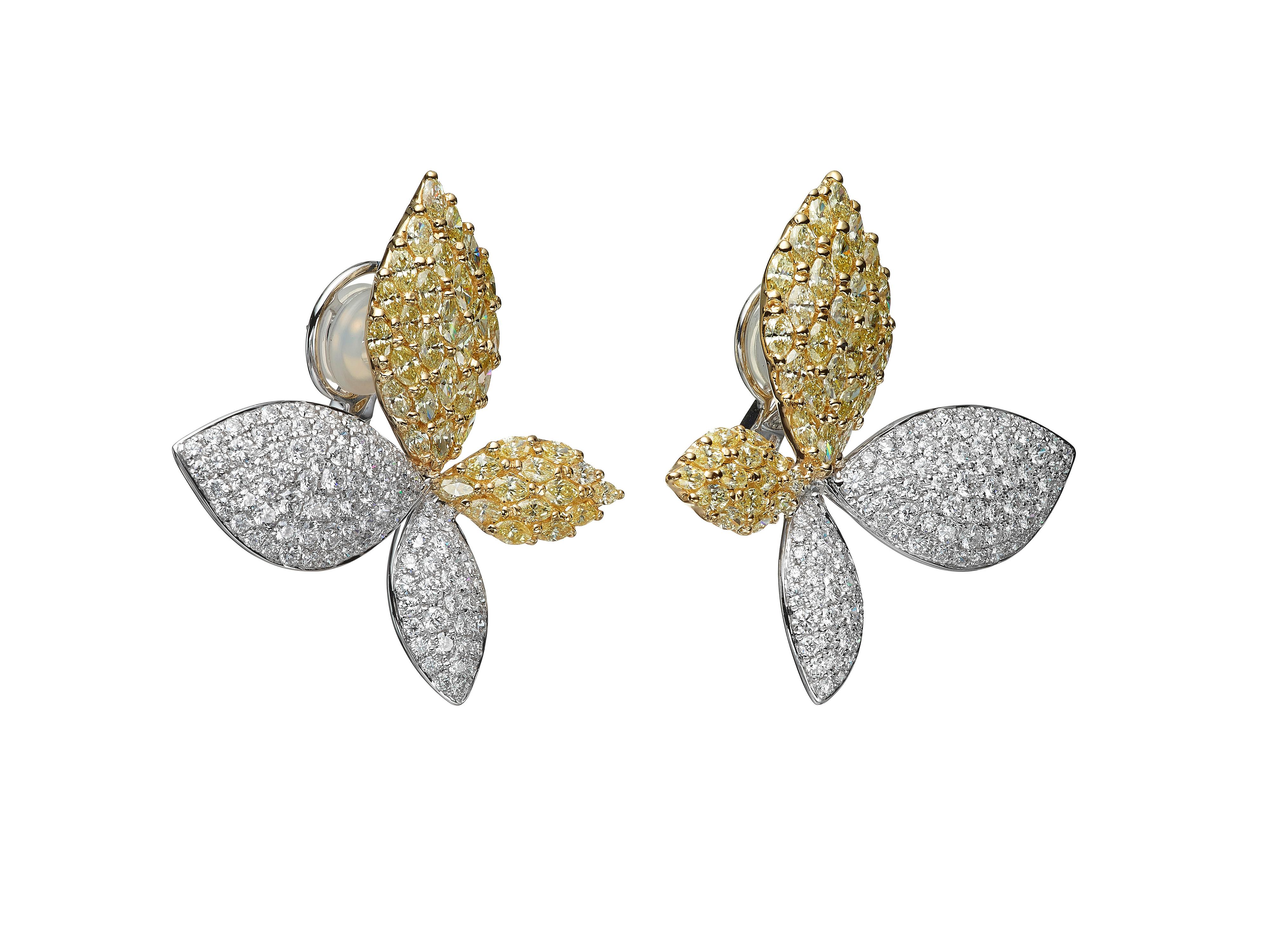8.20 carats of white round diamonds and yellow marquise diamonds cluster to form elegant leaf shaped stud earrings.  Set in 18K white gold and 18K yellow gold.

Composition: 
18K White Gold, 18K Yellow Gold
198 Round Diamonds: 3.45 carats 
80