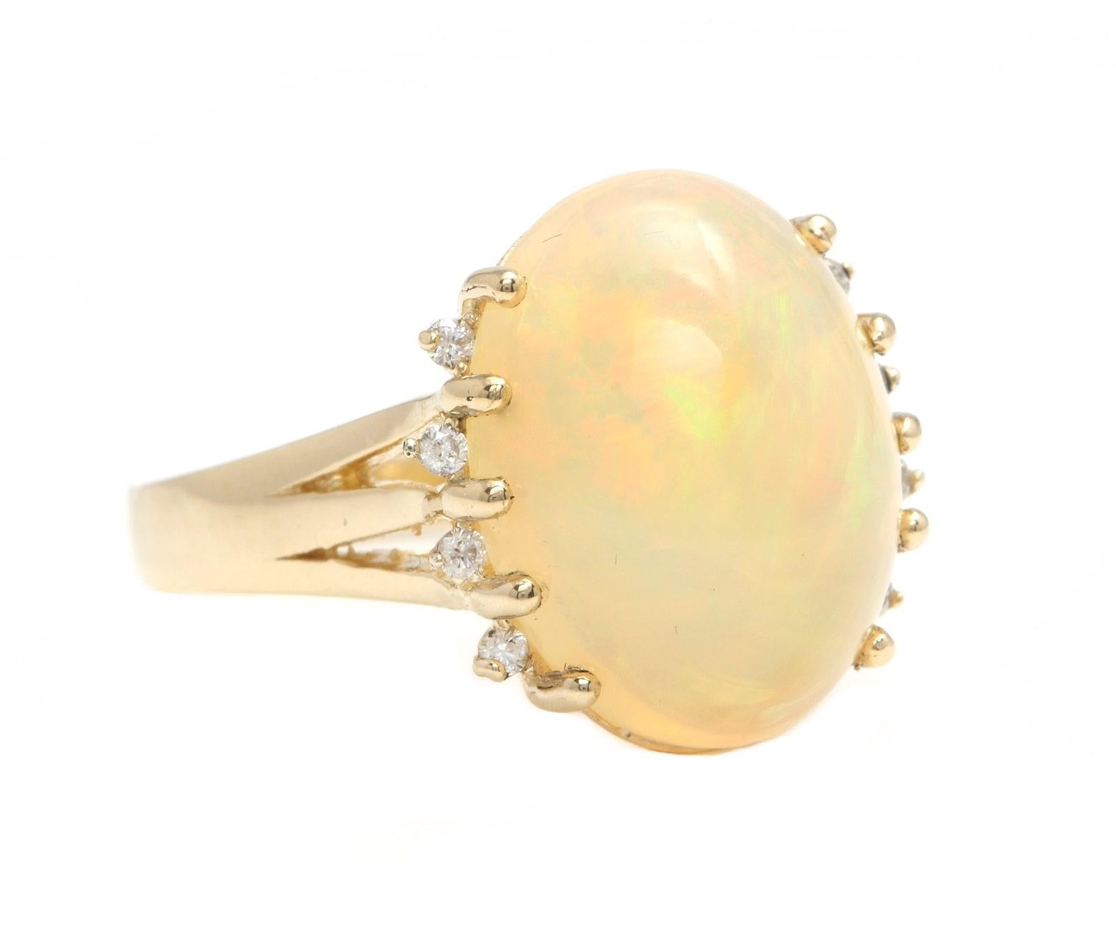 8.20 Carats Natural  Impressive Ethiopian Opal and Diamond 14K Solid Yellow Gold Ring

The opal has beautiful fire, pictures don't show the whole beauty of the opal!

Suggested Replacement Value: $5,500.00

Total Natural Opal Weight is: Approx. 8.00