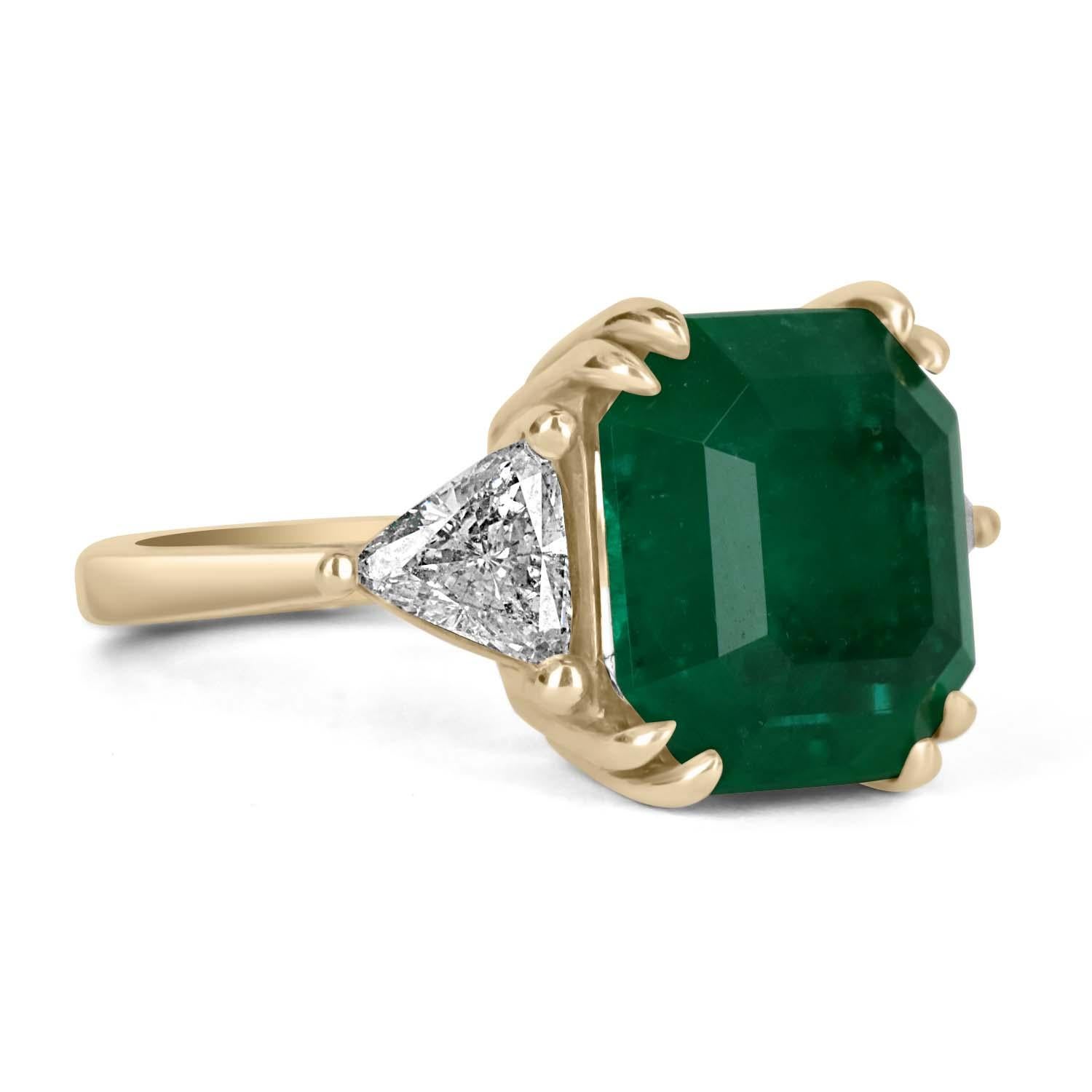 A classic Colombian emerald and diamond engagement, statement, or right-hand ring. Dexterously crafted in 18K gold this ring features a grand 7.04-carat natural Colombian emerald-Asscher cut from the famous Muzo mines. Set in a secure double prong