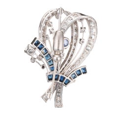 8.22 Carat Diamond Sapphire Platinum Flower Brooch, circa 1940s
